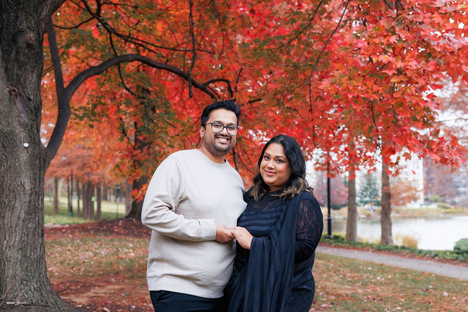 Neam and Asma, a professional photography team, during a fall lifestyle couple session at Rio Lakefront in Gaithersburg, Maryland.