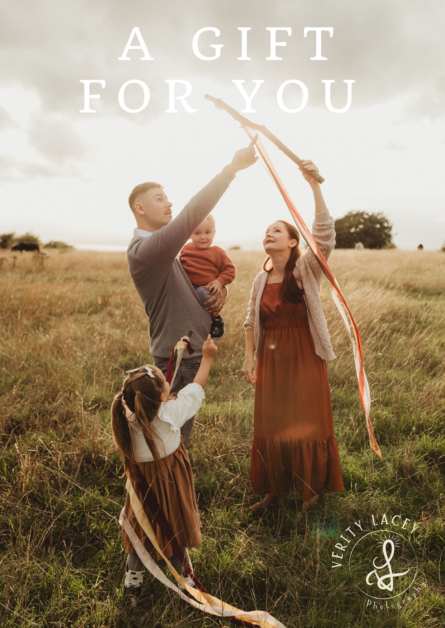 Two people in medieval style clothing dance joyfully together in a sunlit meadow at golden hour.
