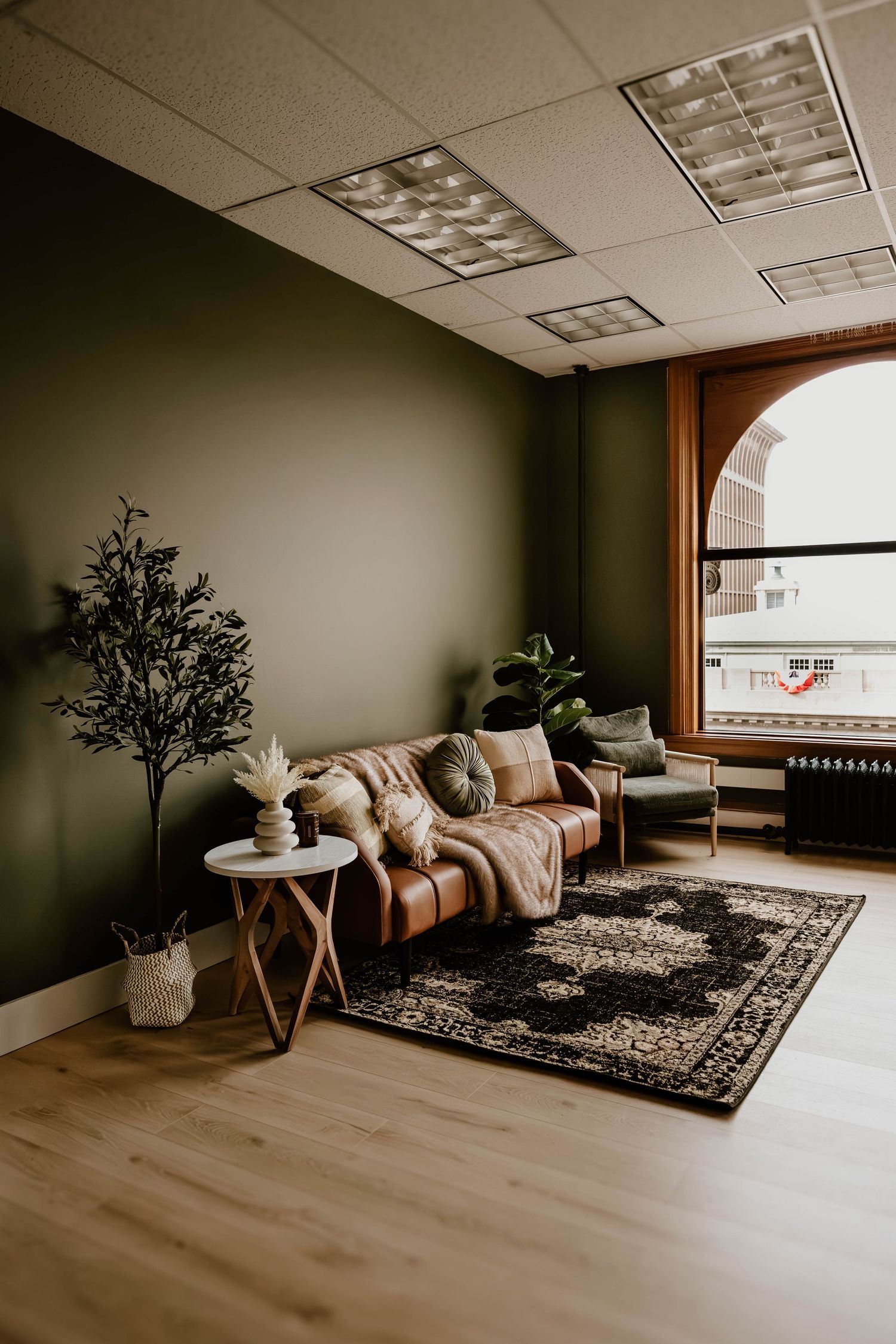 Cozy photography studio setup with curated furniture, natural light, and a warm, moody atmosphere at Everwild Collective Studio in Spokane.