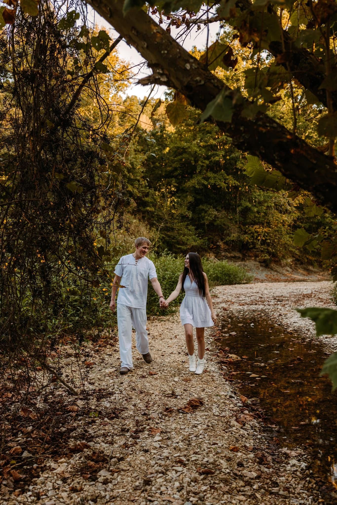 Engagement session at creek, wearing all white
