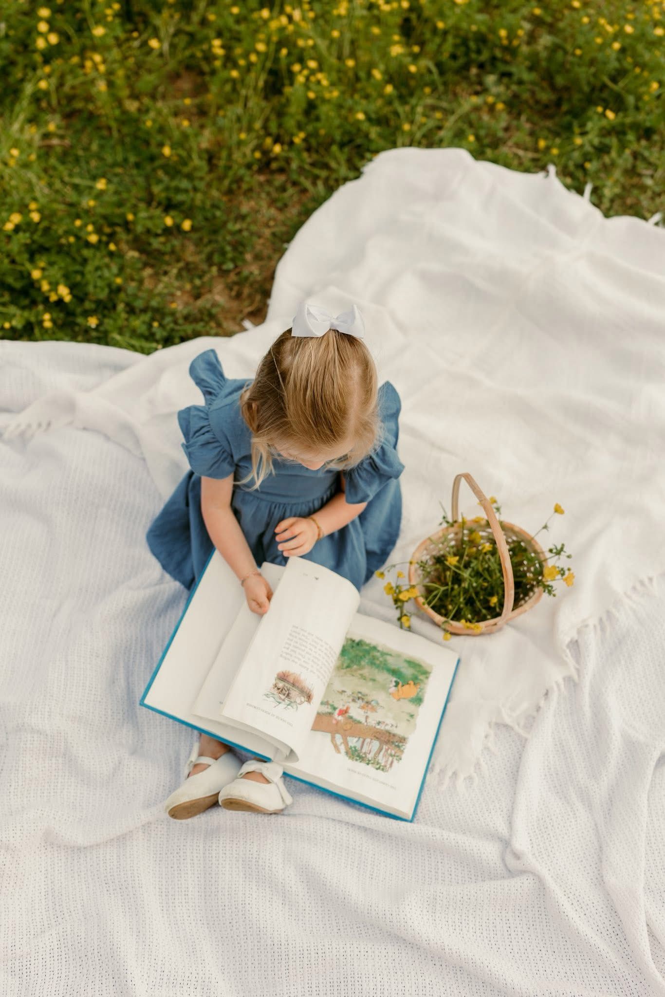 Birthday session for little girl, reading a book, storytelling images