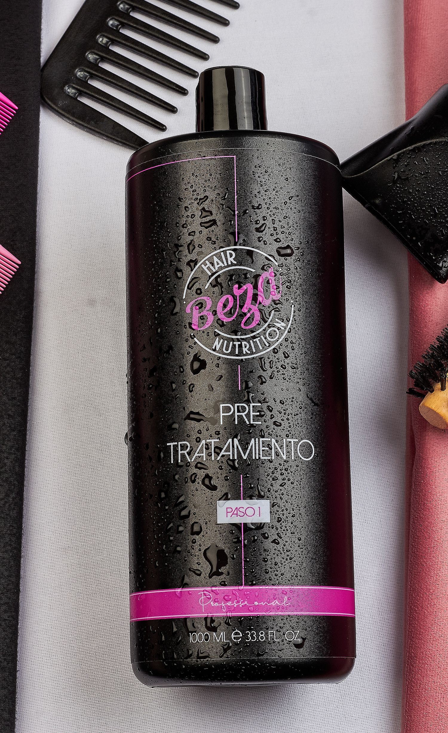 Beza Hair Nutrition Pre Tratamiento Paso 1 large professional hair treatment bottle with pink combs nearby.