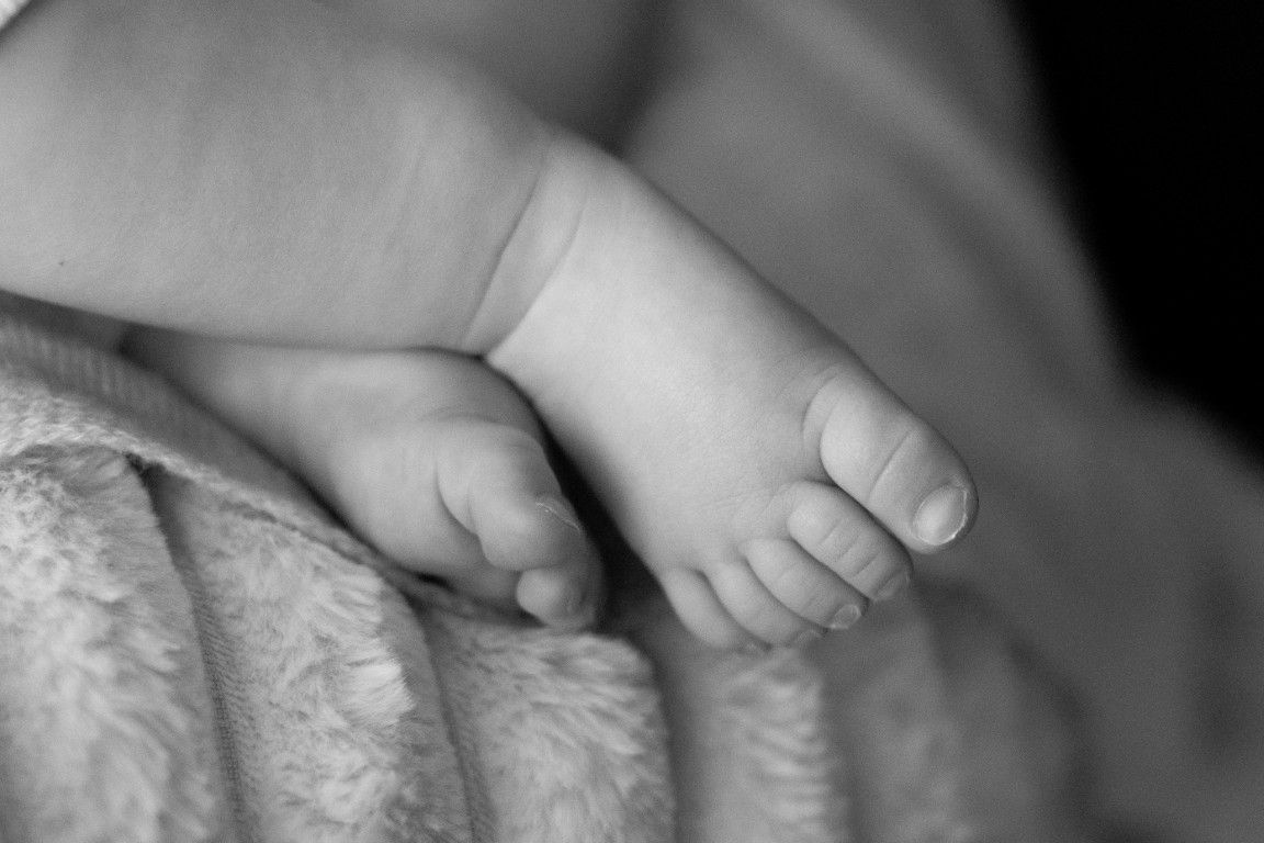 Natural newborn photography showing tiny details in South Wales by Sarah Cullen