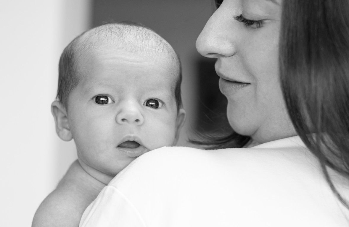 Candid black and white child portrait in South Wales by Sarah Cullen