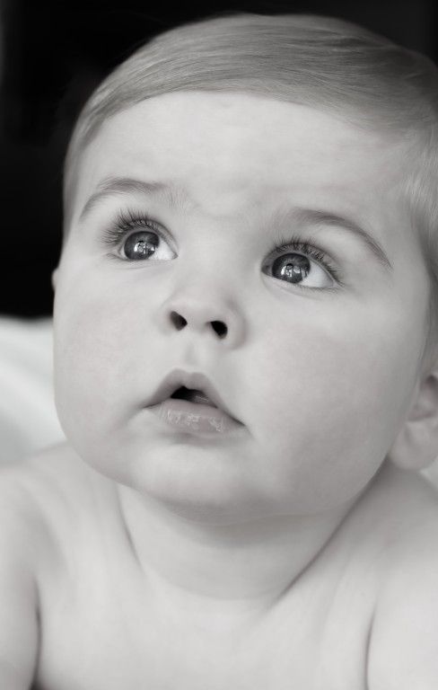 Candid black and white child portrait in Pontypool, South Wales by Sarah Cullen