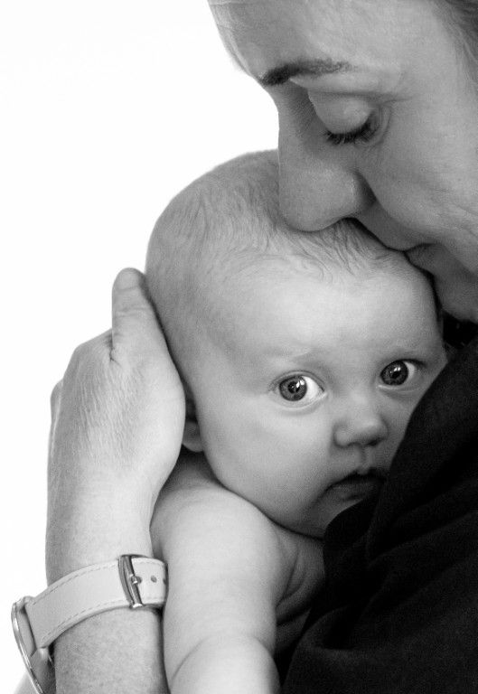 Mother and Baby photo of mother hugging baby in Newport, South Wales
