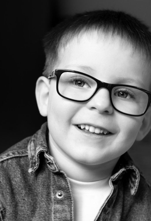 Candid black and white child portrait in Newport, South Wales by Sarah Cullen
