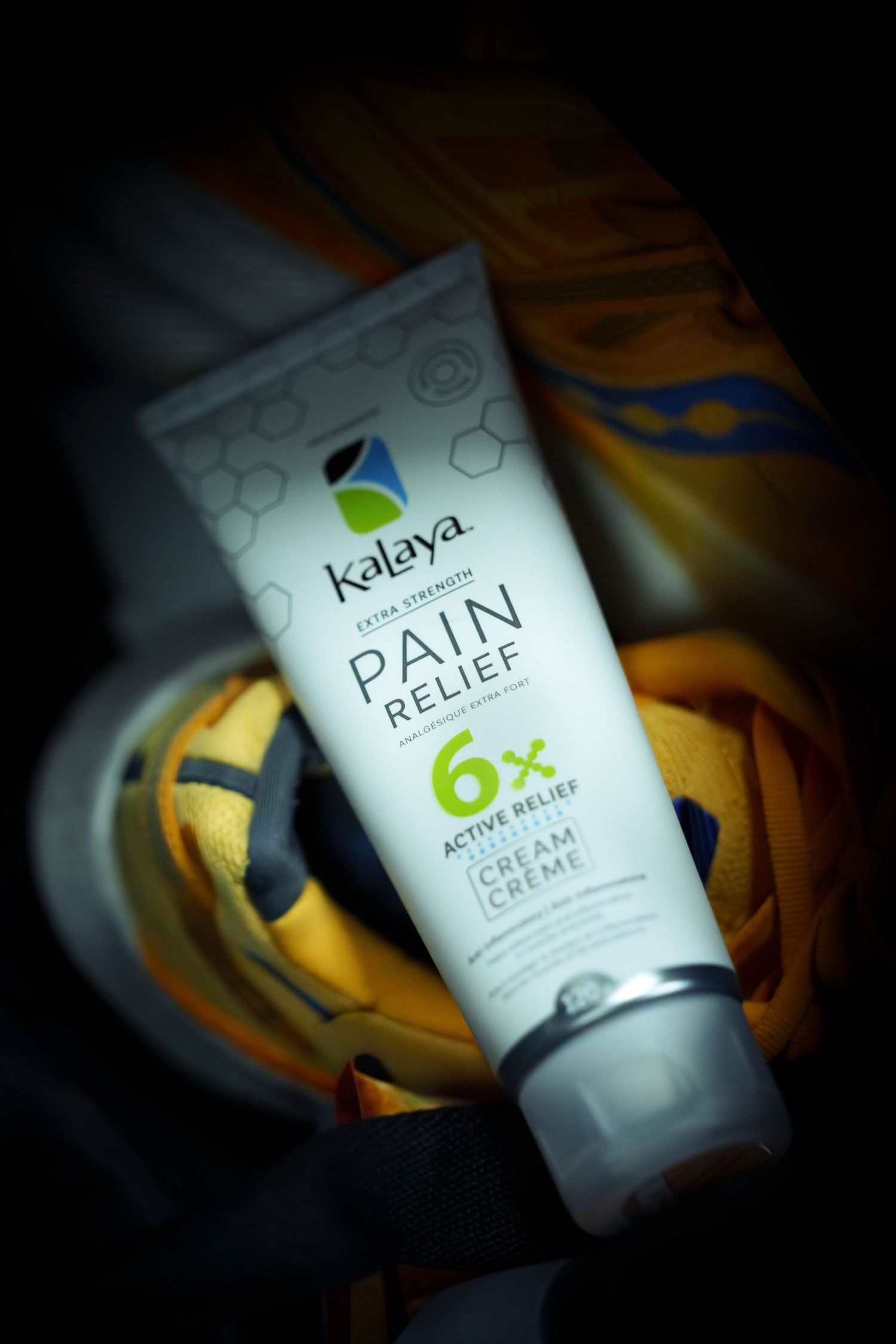Product photography of a tube of pain relief cream. Bottle reads 