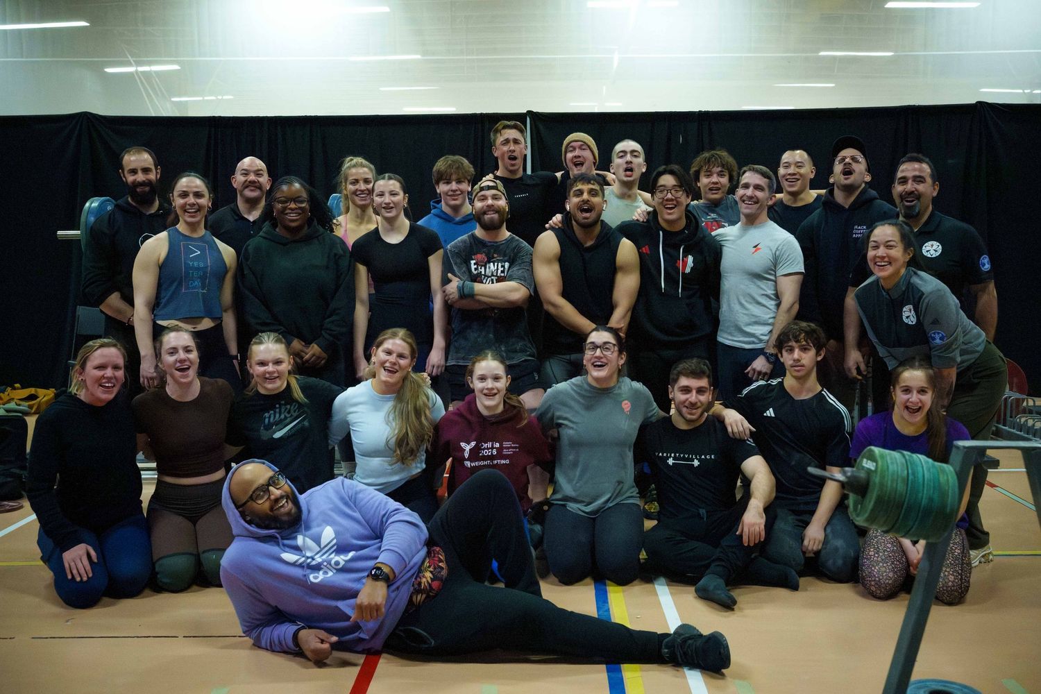 Group photo of a youth and senior training camp for olympic weightlifting.