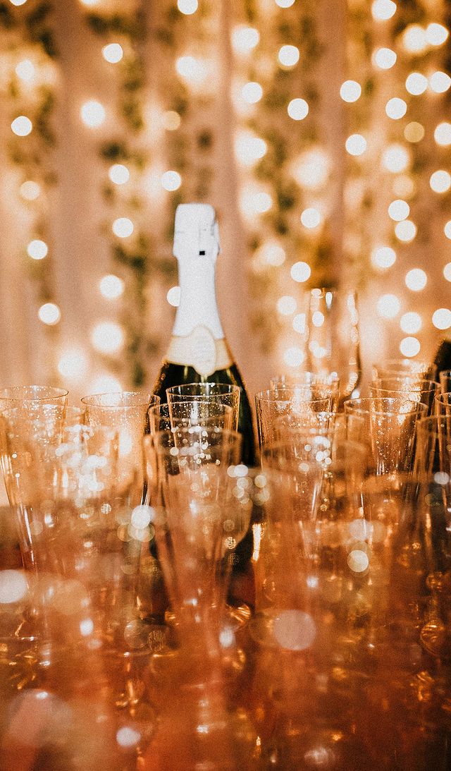 Silhouette portrait through warm golden lights, artistic lifestyle photography with dreamy bokeh and moody tones