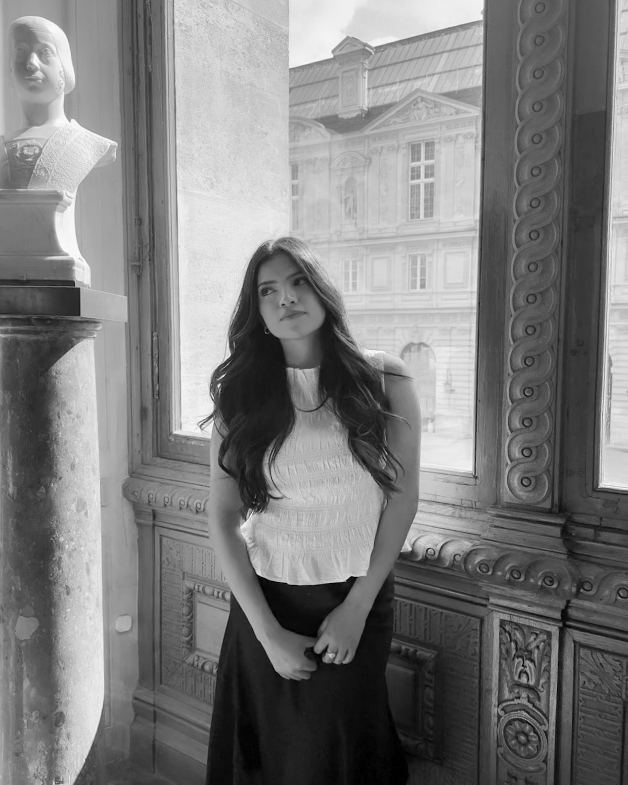 Portrait of photographer Yulissa Arriaga in Tyler, Texas, showcasing the artist behind Arriaga Photography in a timeless black and white set
