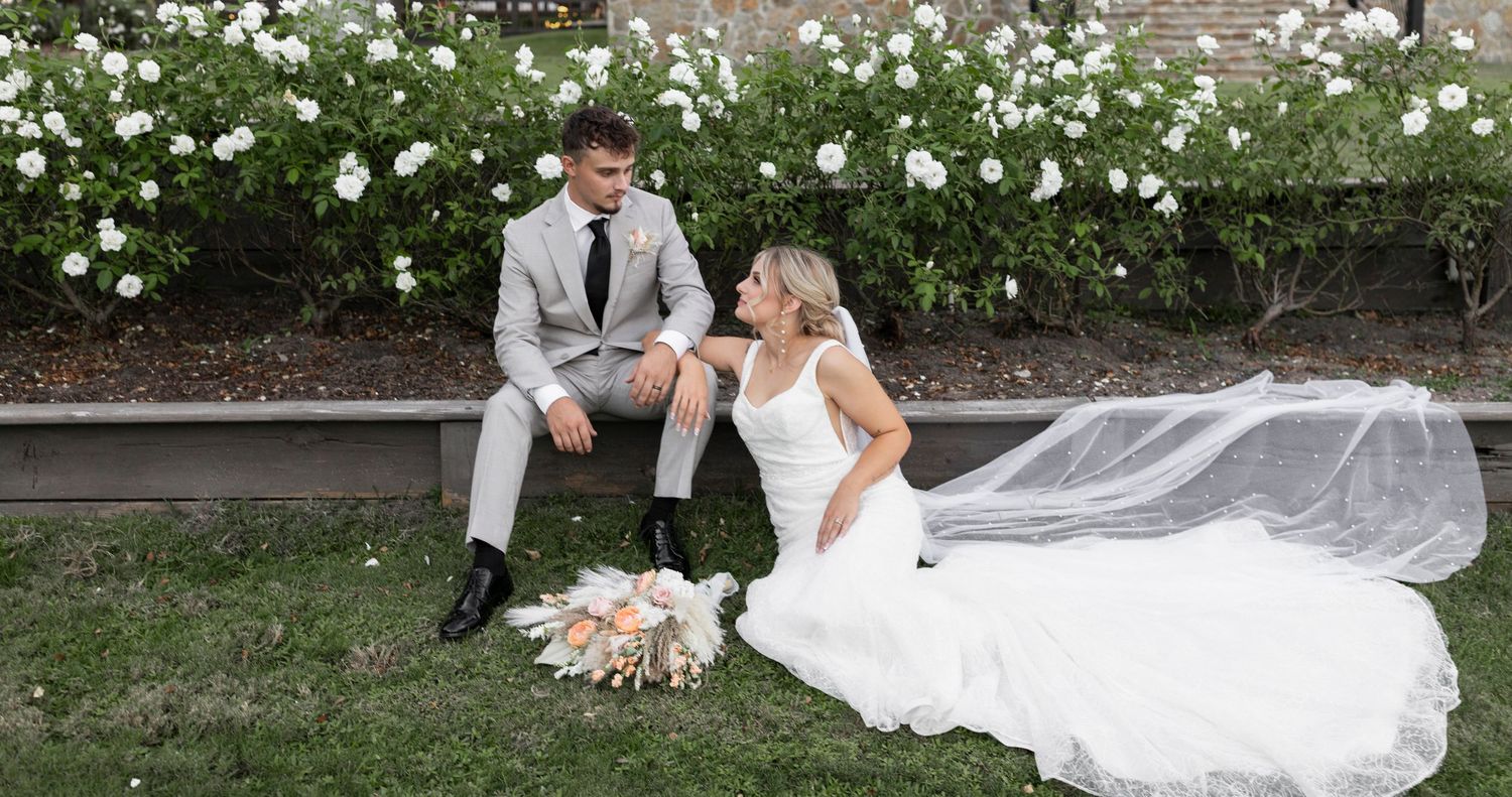 Bride and groom sitting together after ceremony, romantic wedding moment captured in Tyler, Texas with natural light