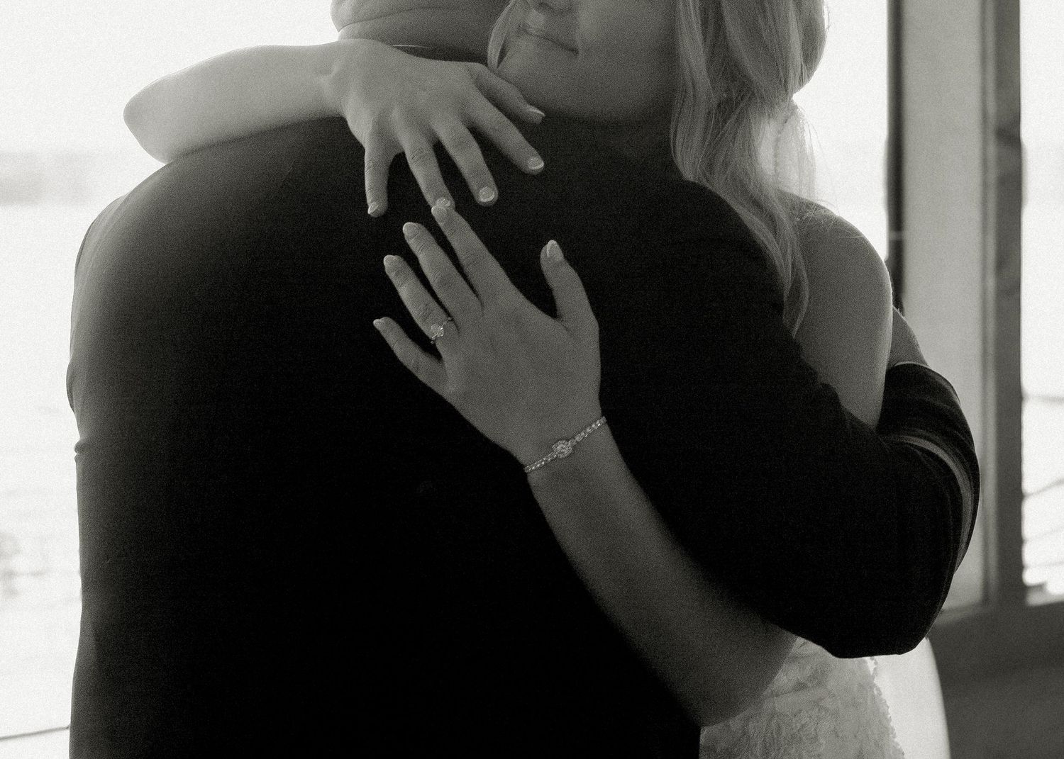 Black and white wedding photography capturing an intimate moment between bride and groom during their wedding day.