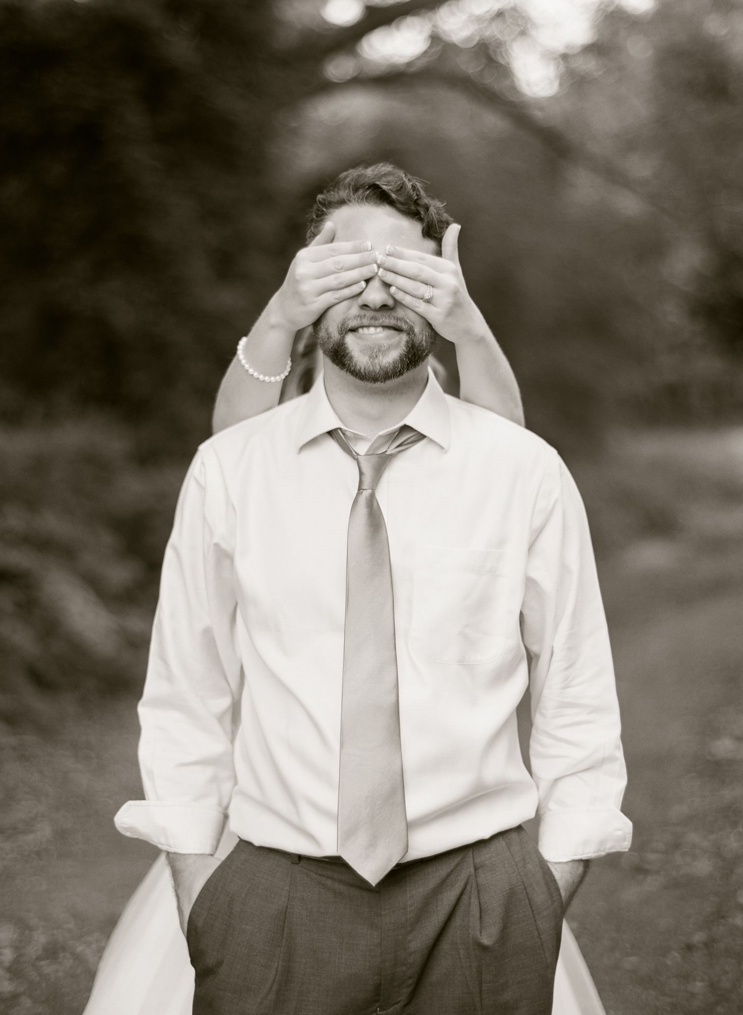 Black and white portrait sequence showing playful expressions and gestures.