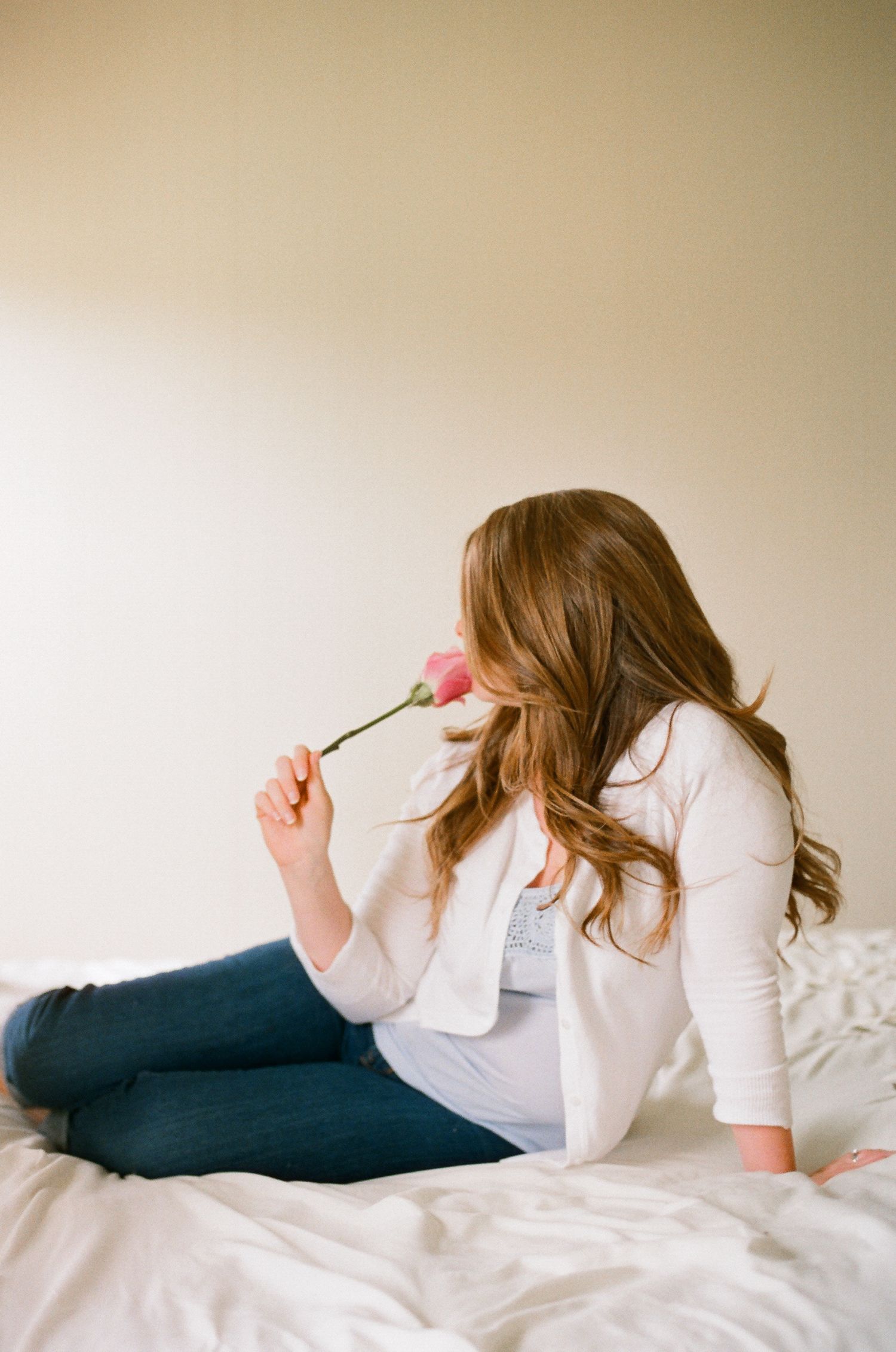 Artistic boudoir photography sequence showing casual poses in white and navy clothing.