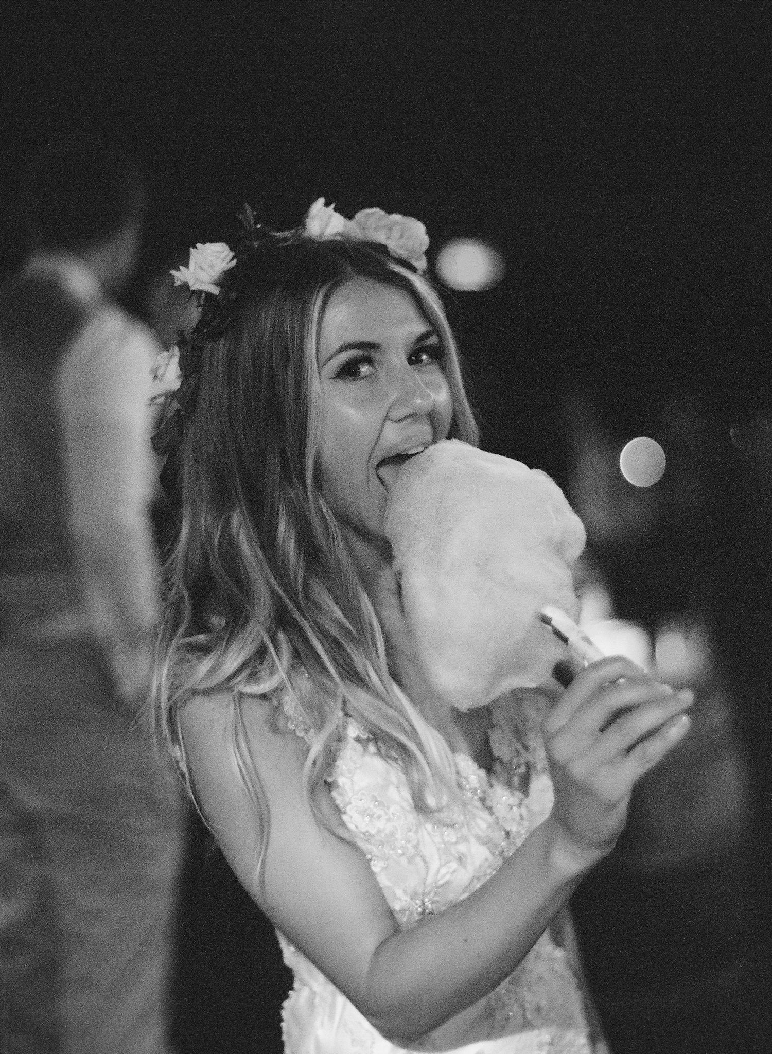 Black and white photo sequence of someone enjoying cotton candy at an outdoor event.