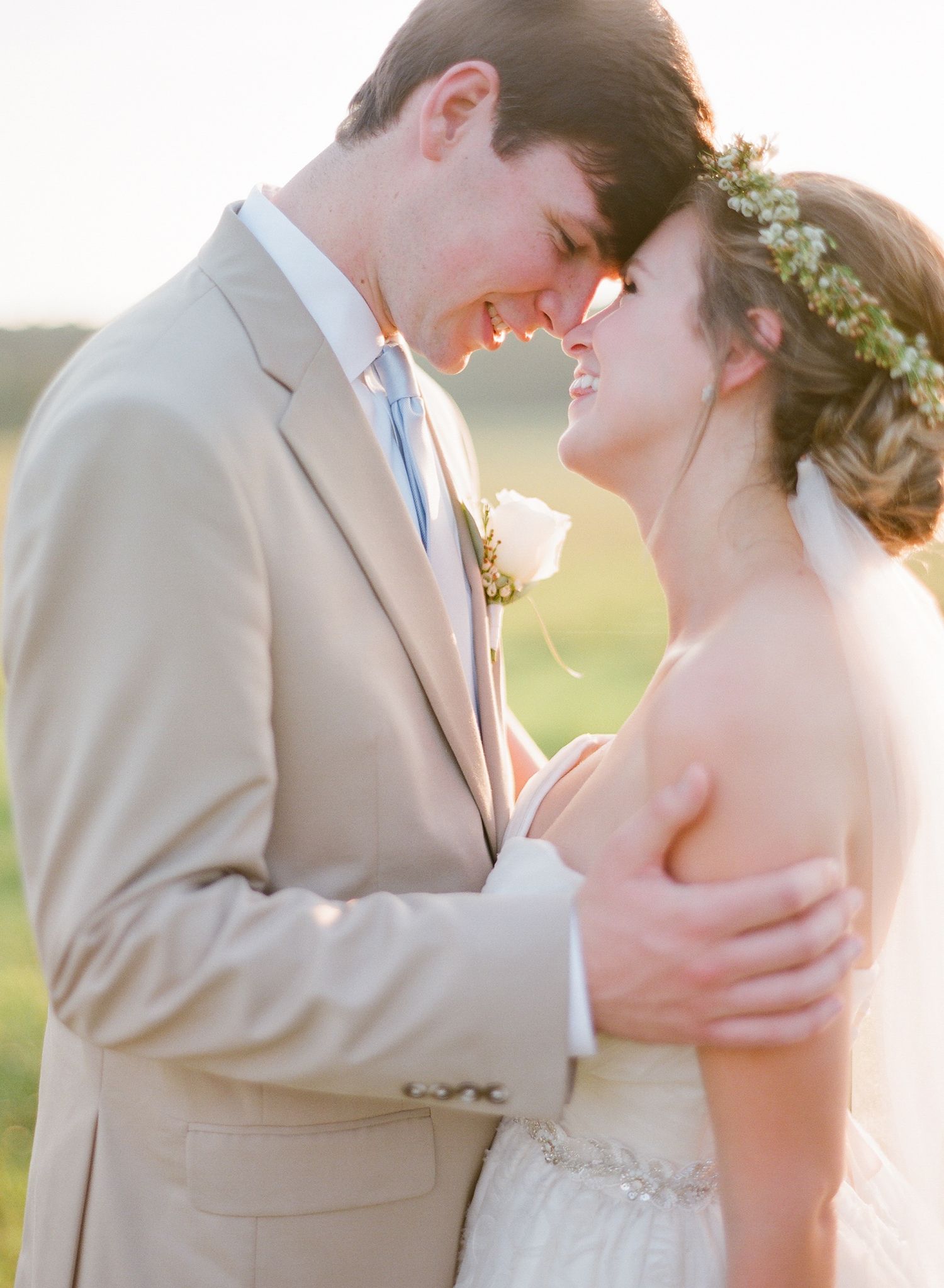 Romantic wedding couple portraits showing intimate moments in natural light.