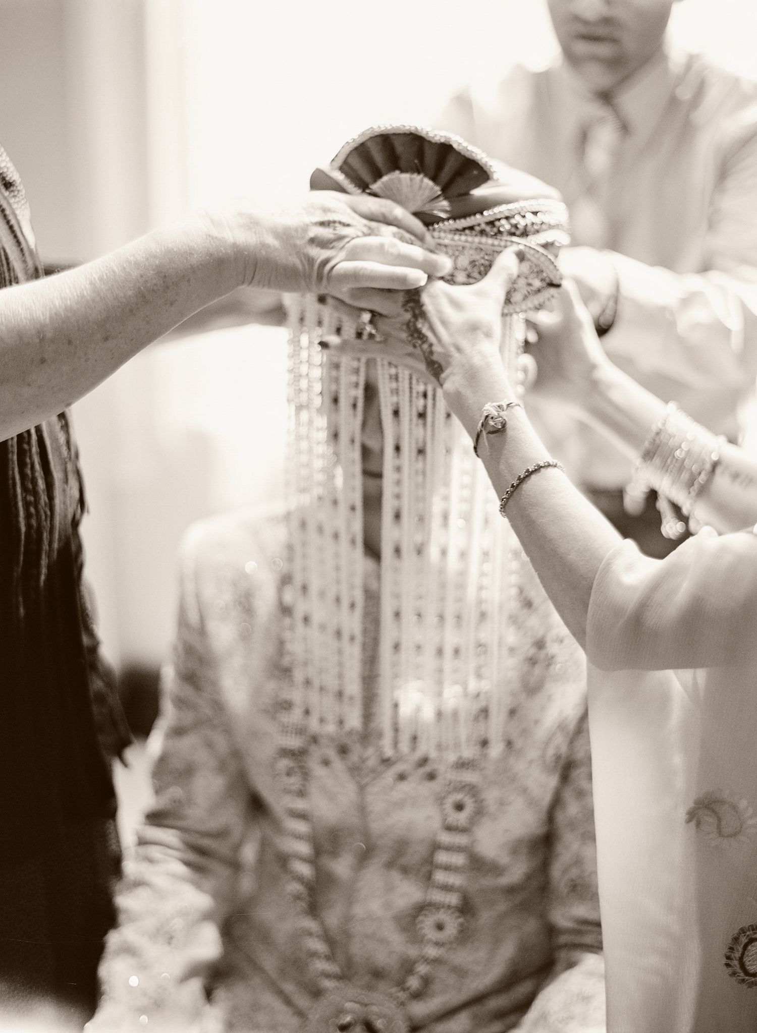 Close-up detail shots of traditional clothing and jewelry preparations.