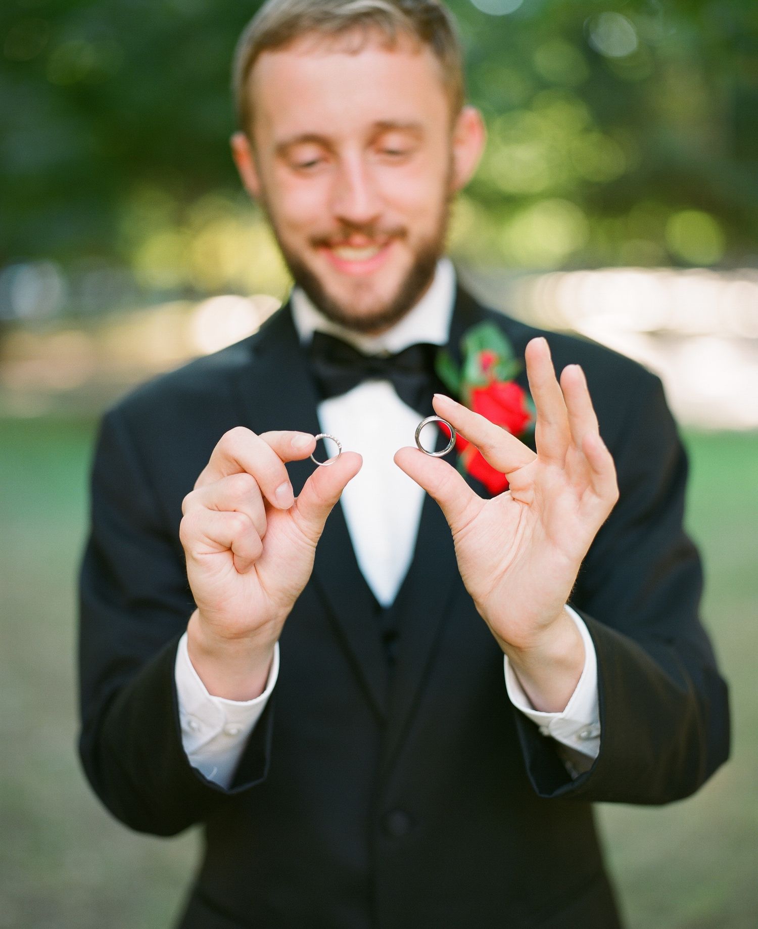 Sequential shots of groom's hands showing wedding rings against dark suit background.