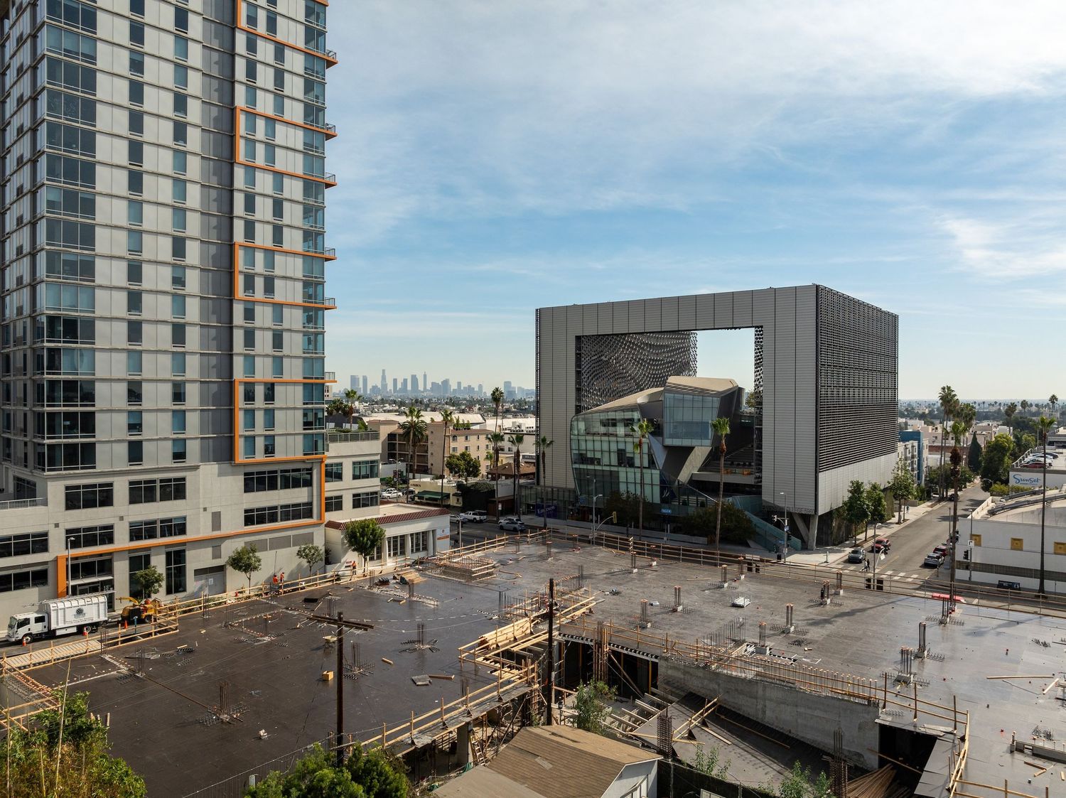 Panoramic view of modern urban development with high-rise buildings and construction site.