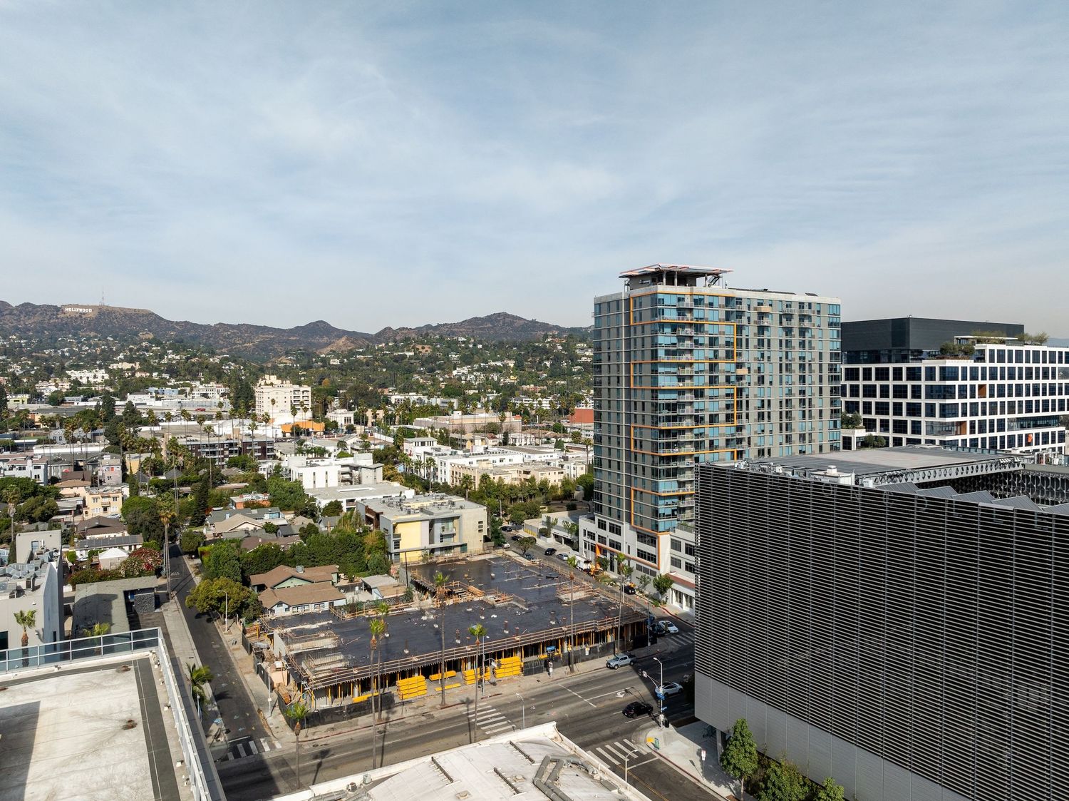 Aerial view of city streets and buildings under development in an urban setting.