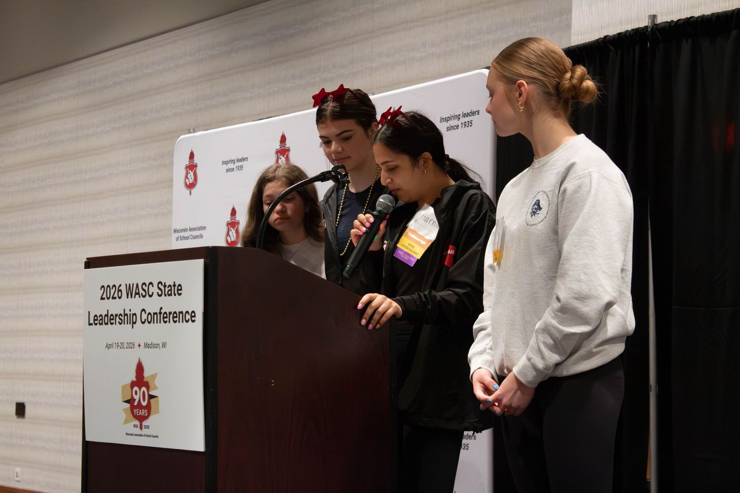 Students presenting at podium during 2026 WASC State Leadership Conference in Madison, WI.