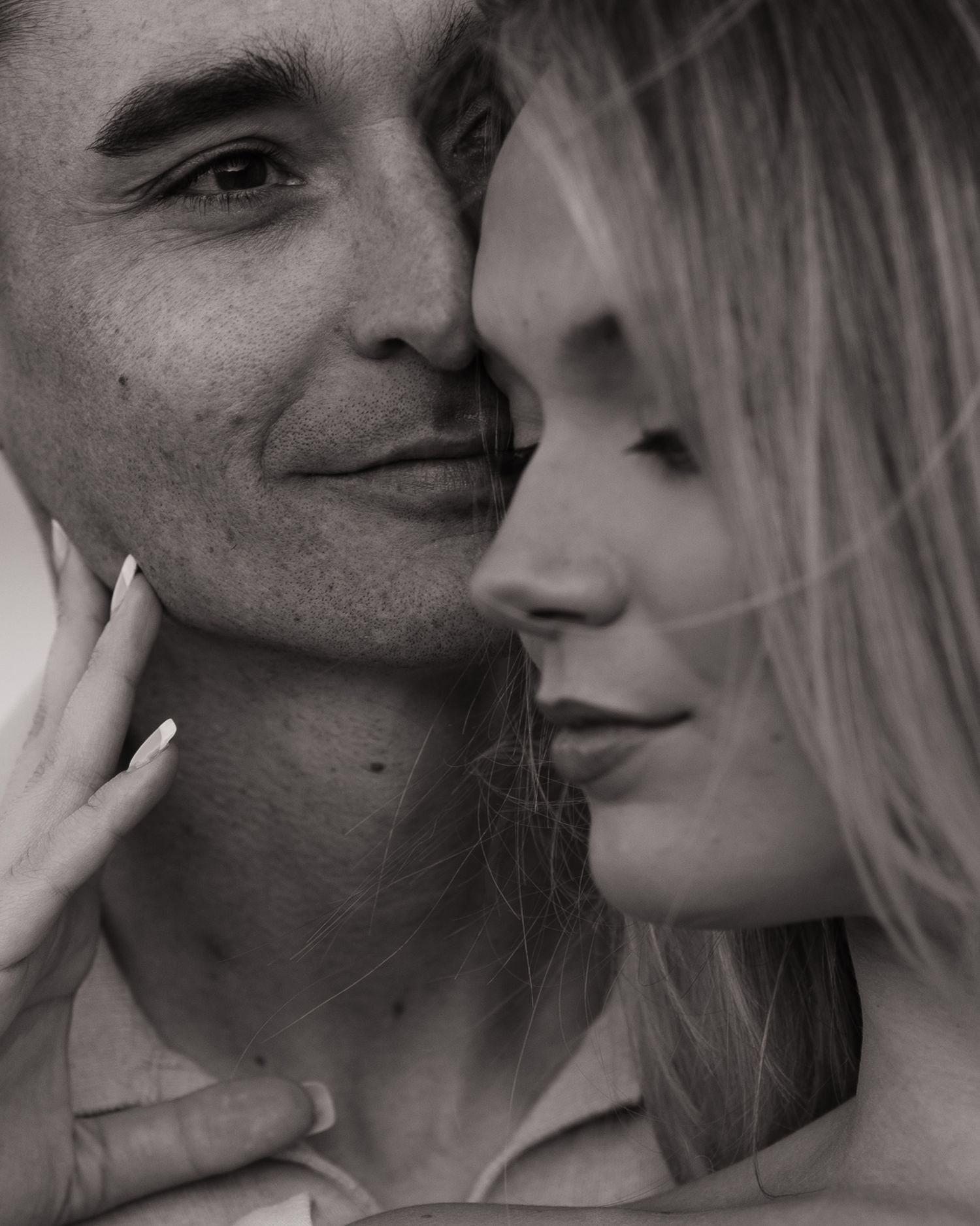 Close up artistic black and white portrait of romantic couple.