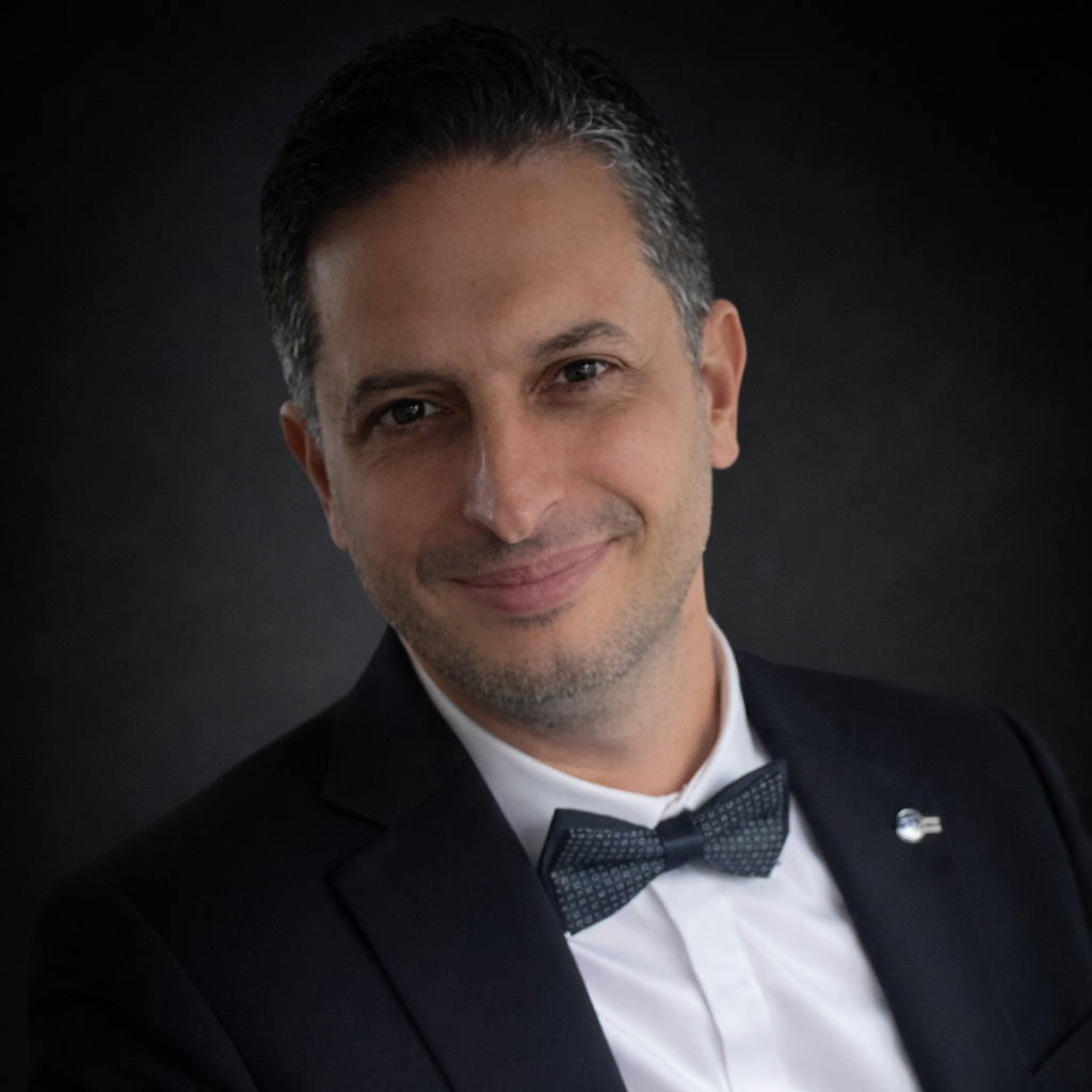 Portrait series of a man in formal attire with bow tie against dark backdrop.