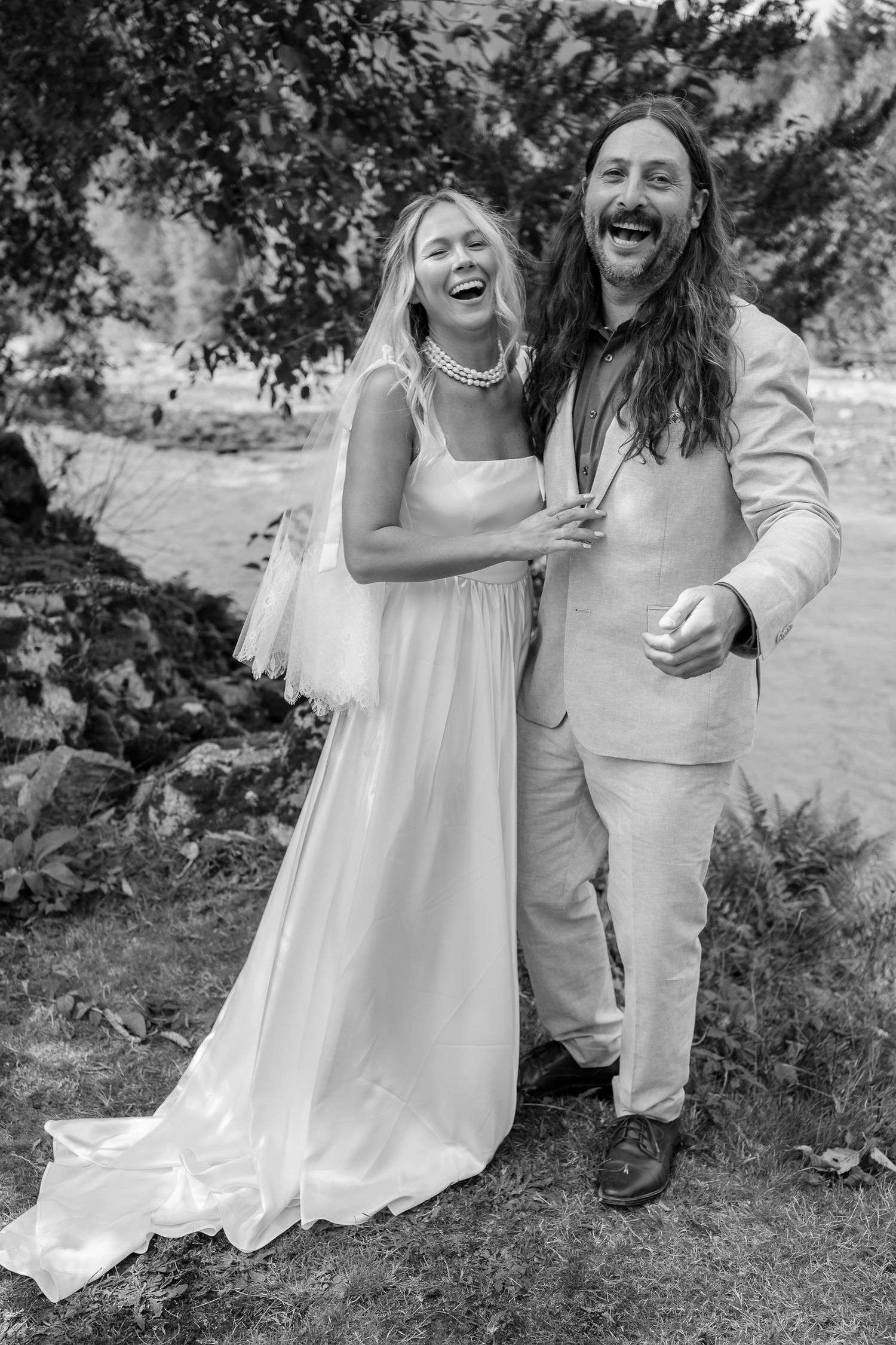 Relaxed wedding photography capturing authentic human connection, laughing and happy.