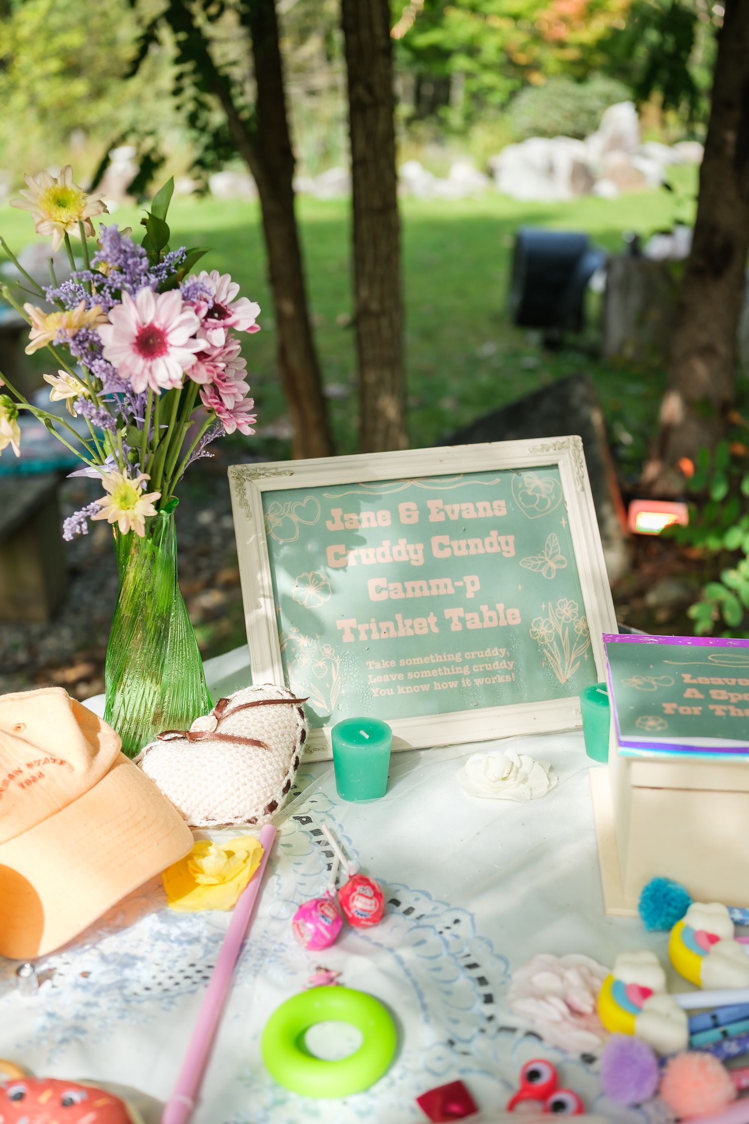 Candid wedding detail photography of welcome table, flowers, and custom signage