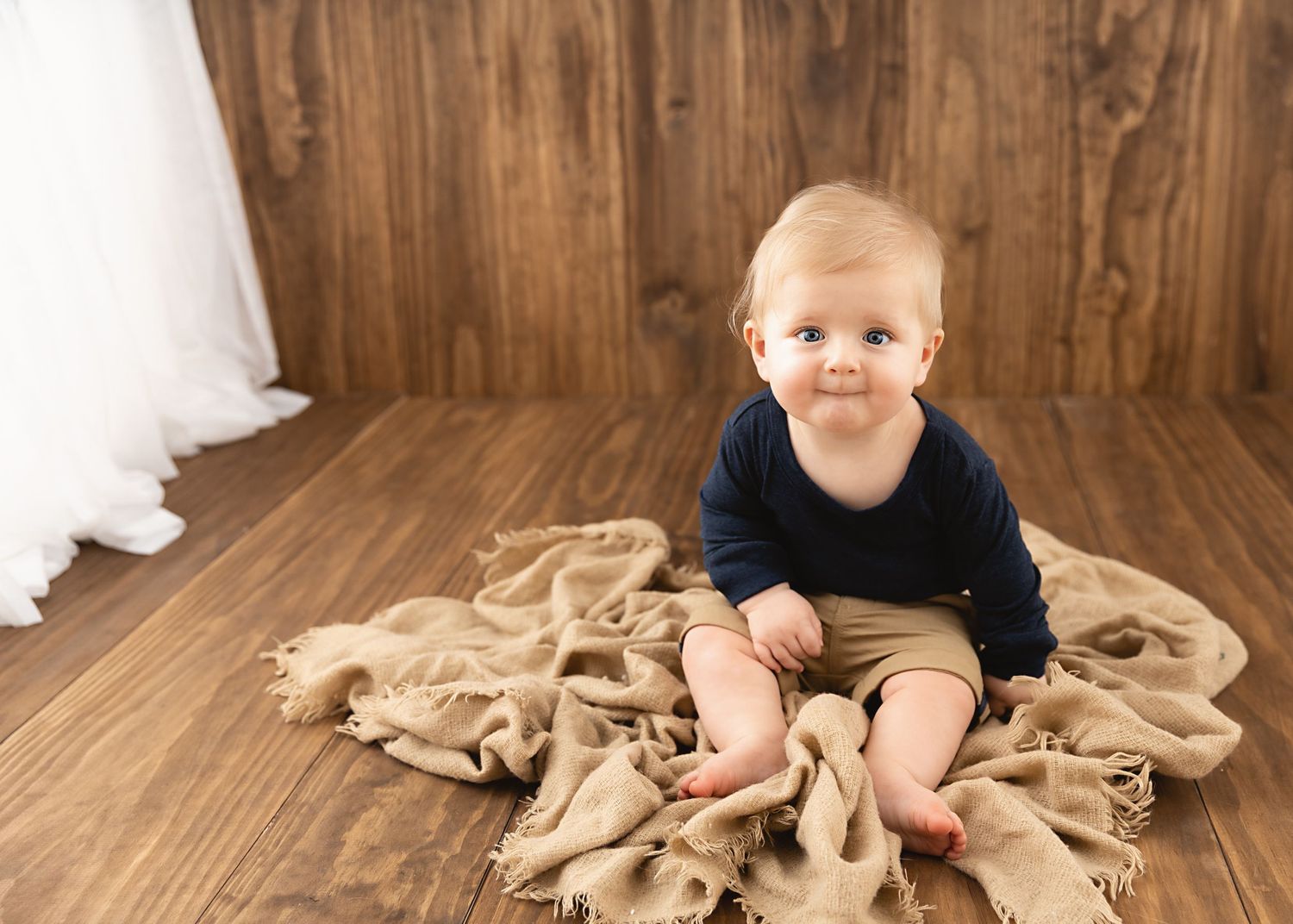 Baby milestone photography session in a simple studio setting in Singleton NSW