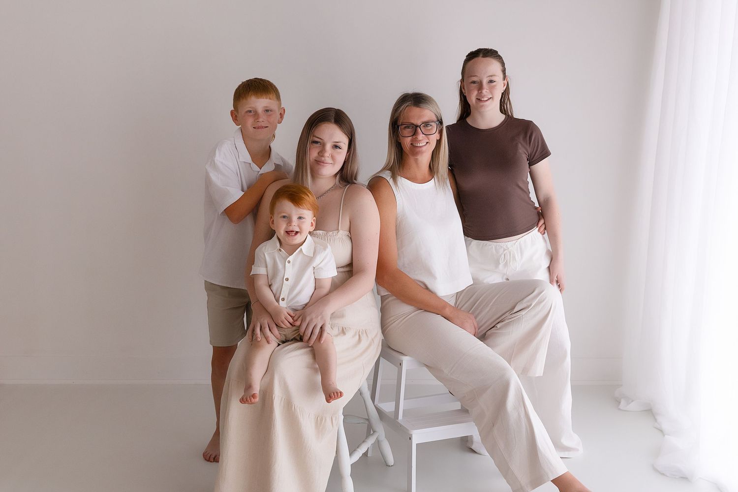 Multi-generation family during a relaxed studio family photography session in Singleton NSW