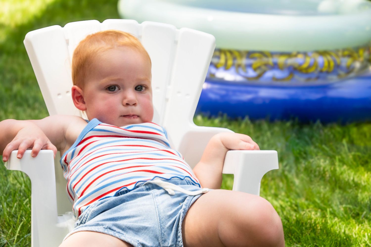 a toddler in a beach chair