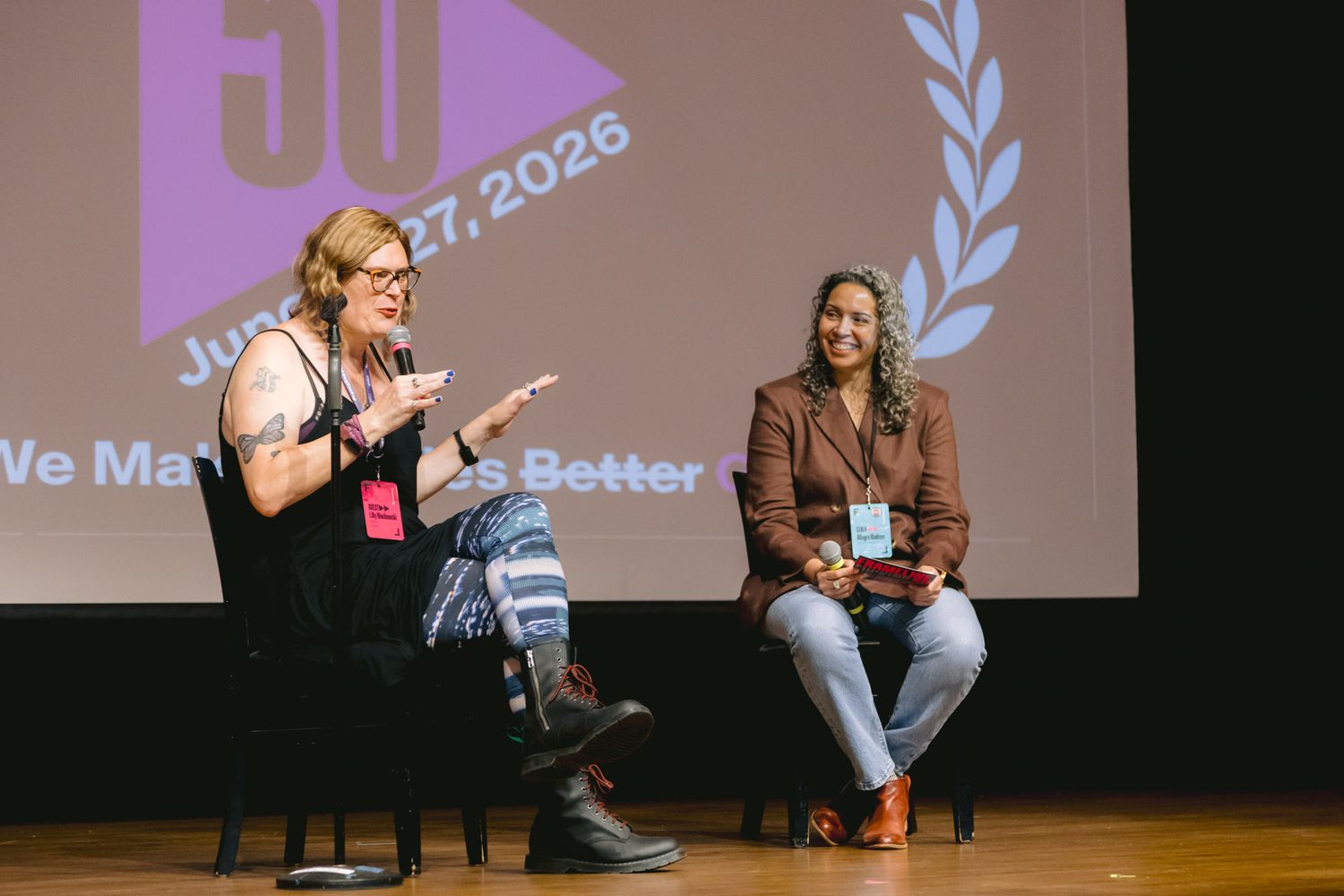 Two women seated on stage during a panel discussion at Frameline50 queer cinema festival event.