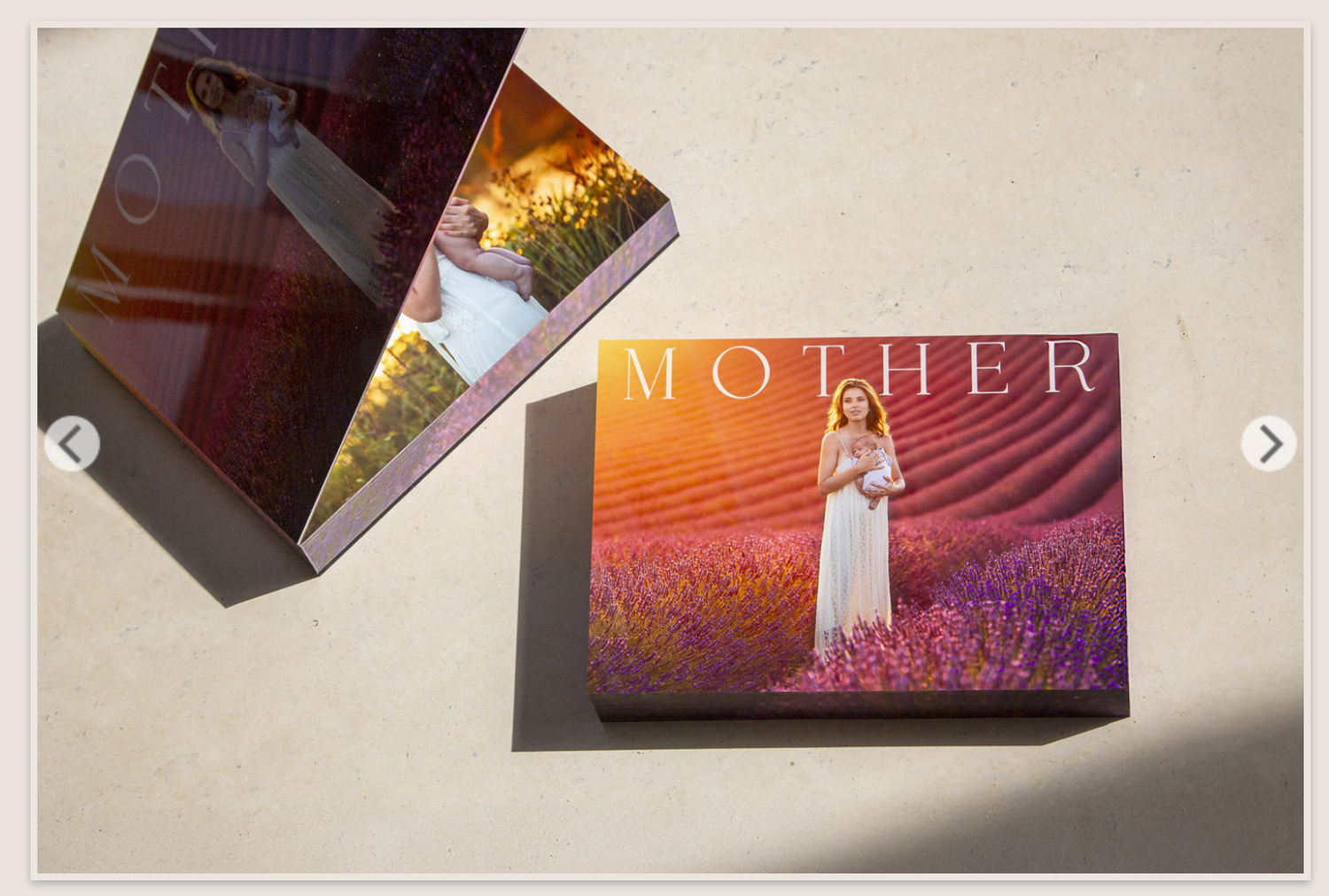 Hardcover MOTHER photo book lying flat displaying woman in purple lavender field cover.