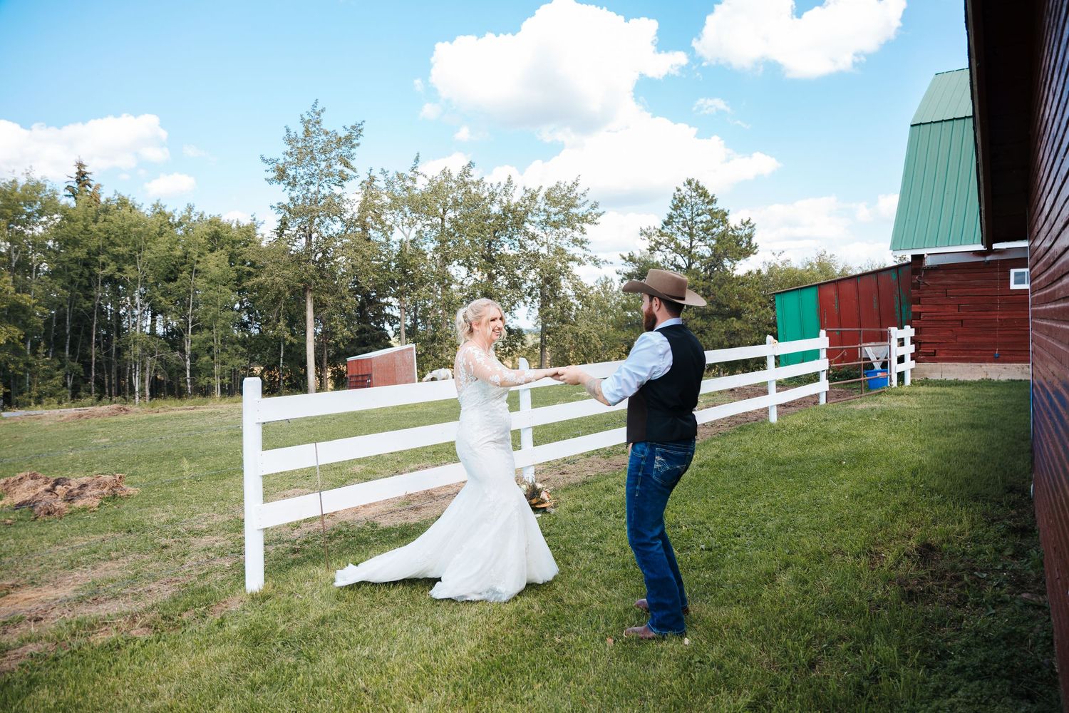 Athabasca wedding photographers, western wedding decor, calgary photographers, barn venues, bride and groom dancing in a field with horses