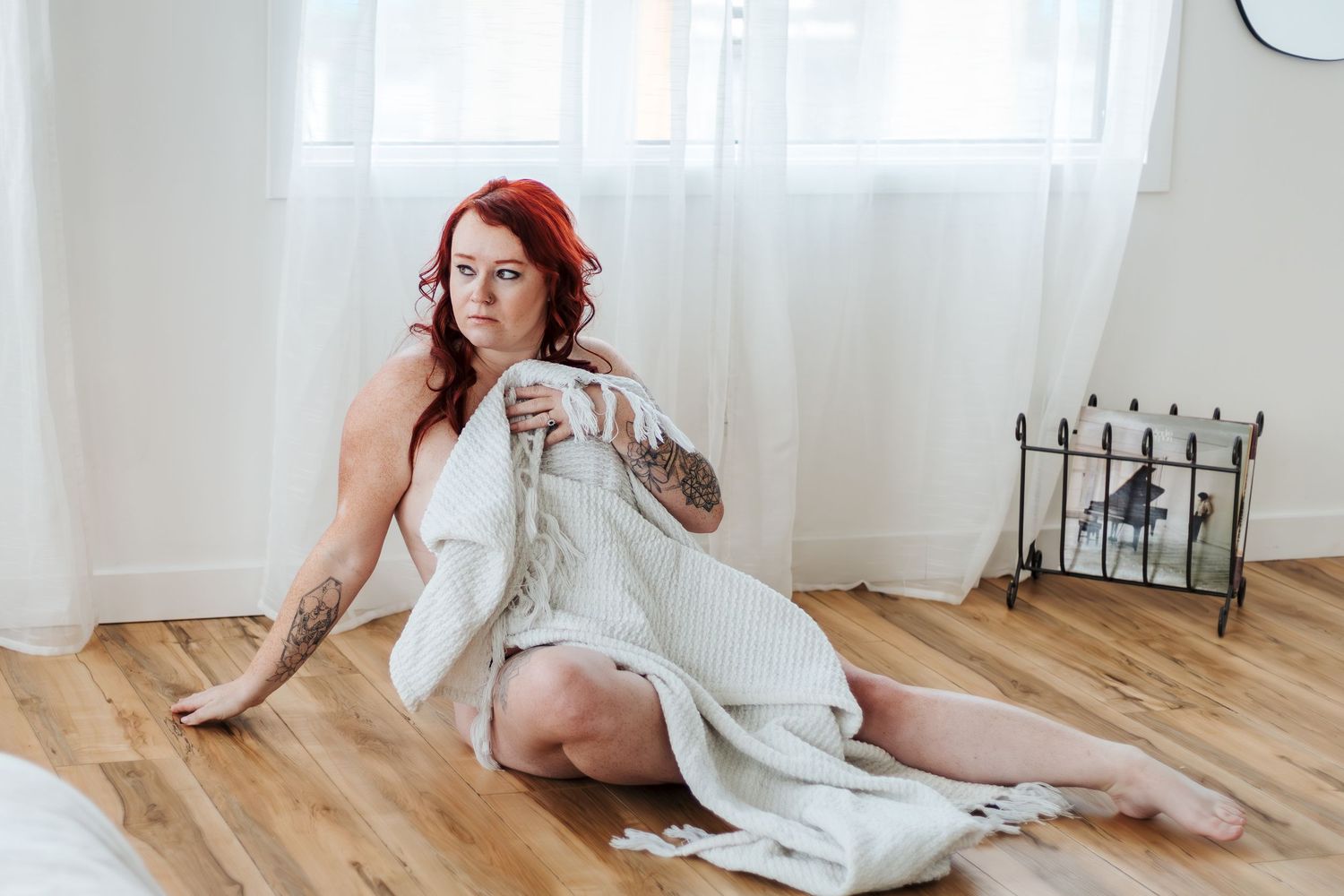 edmonton boudoir photographer, womens empowerment, bridal boudoir, spruce grove photography, womens with red hair sits with blanket