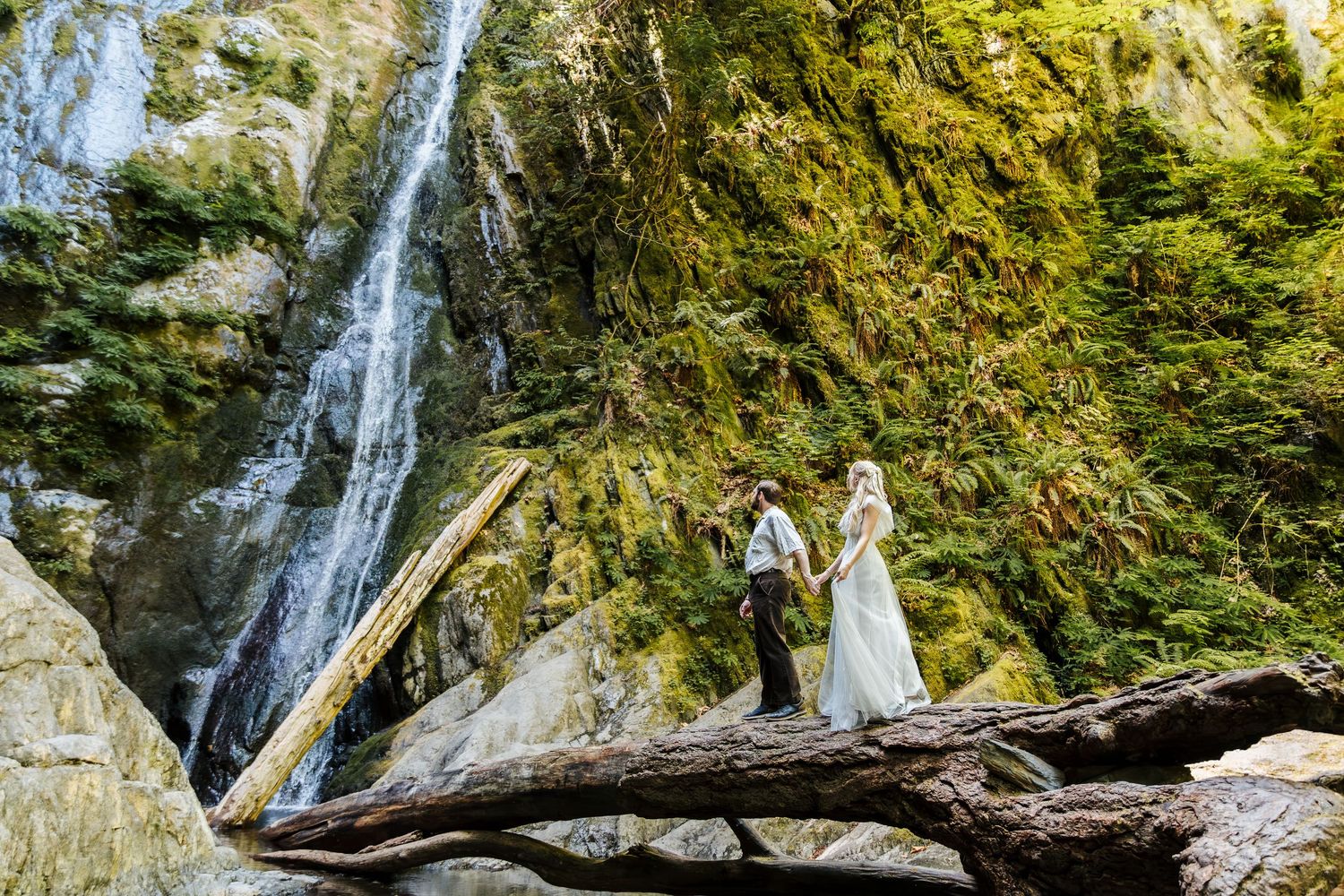 Vancouver island elopement photography, rainforest wedding pictures, bride and groom in front of waterfall, oak and vine venue,