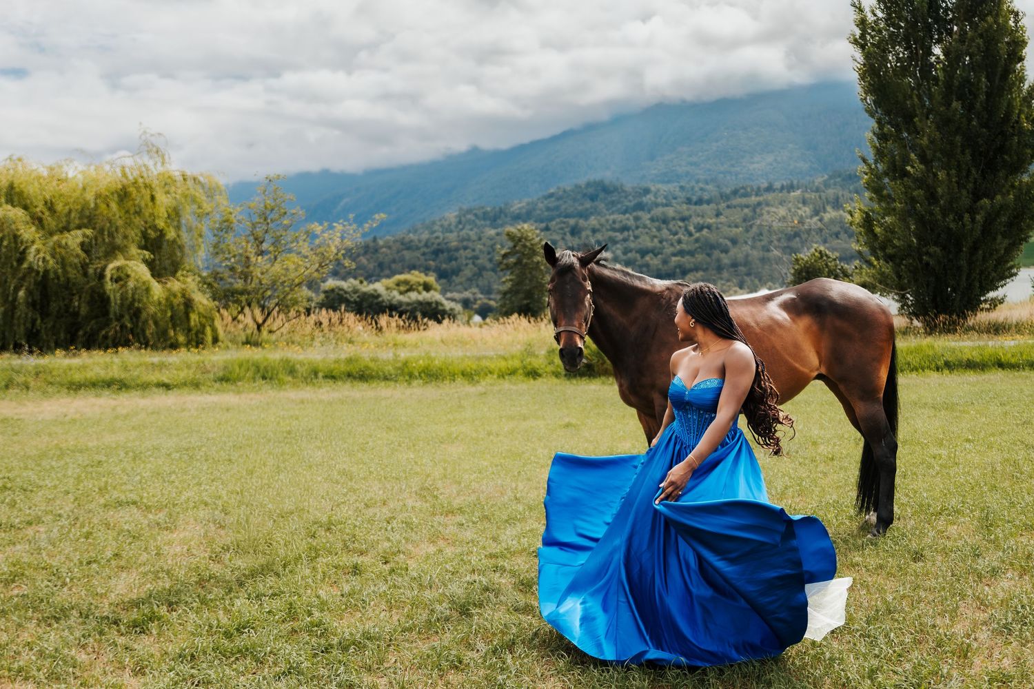 girl in blue dress dancing in front of horse. Graduation photos. Family photography Leduc and St.Albert. Fraser Valley wedding photographers