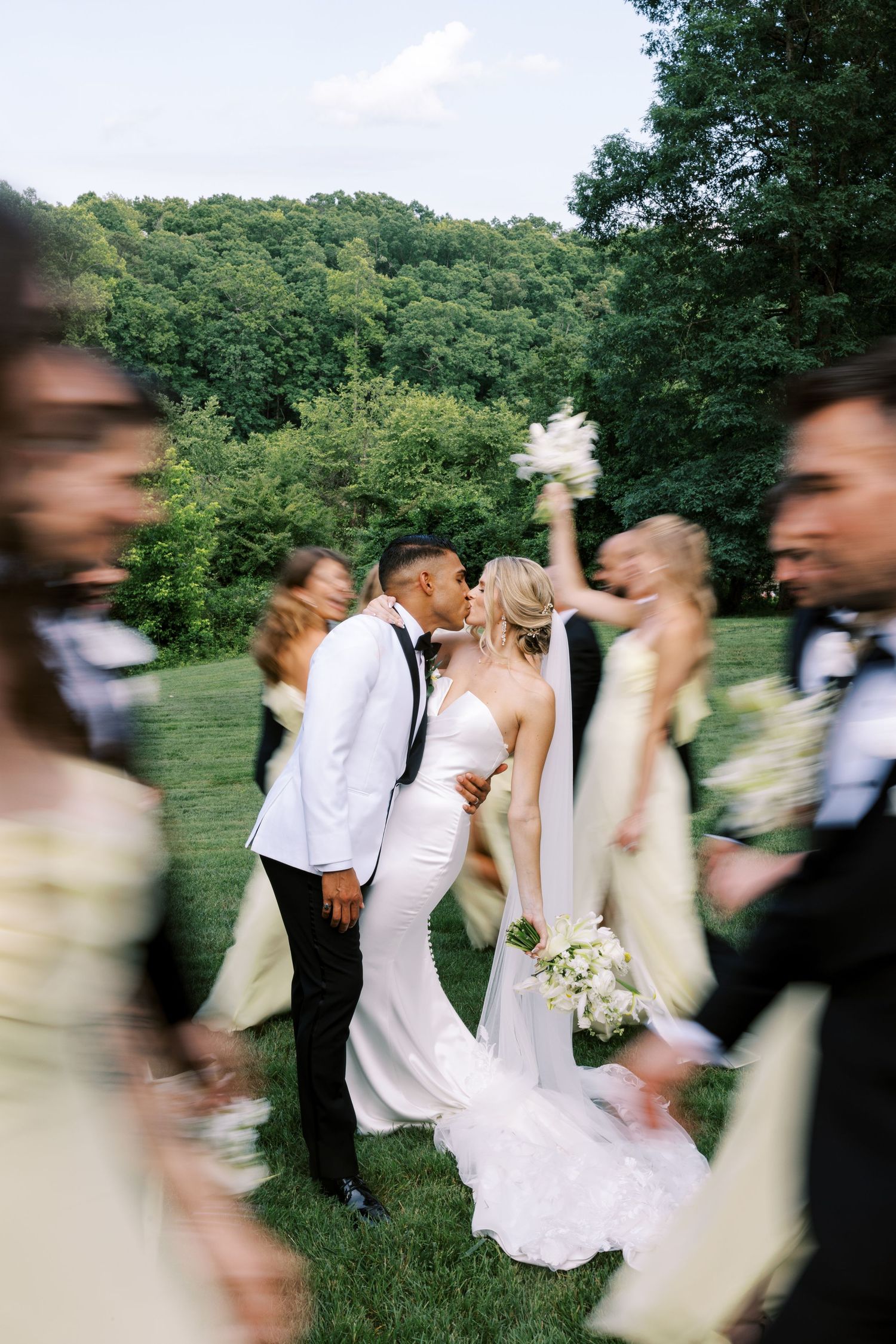 A series of motion-blurred wedding photos showing a couple dancing and twirling in an outdoor garden setting.