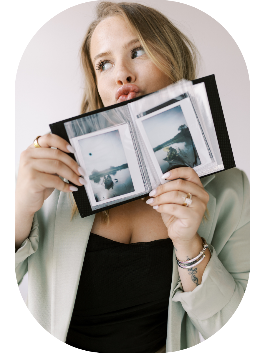 A person in a light blazer holds up polaroid photos against a neutral background in a series of four images.