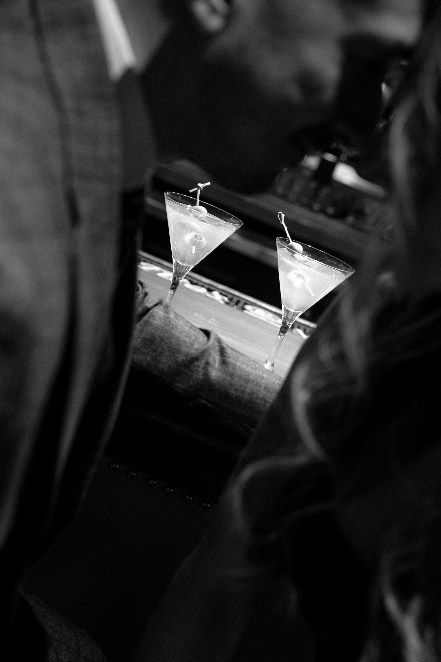 A black and white photo sequence showing a paper airplane gliding through dark space with motion blur effects.
