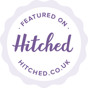 Purple scalloped badge collection showing Hitched featured vendor status.