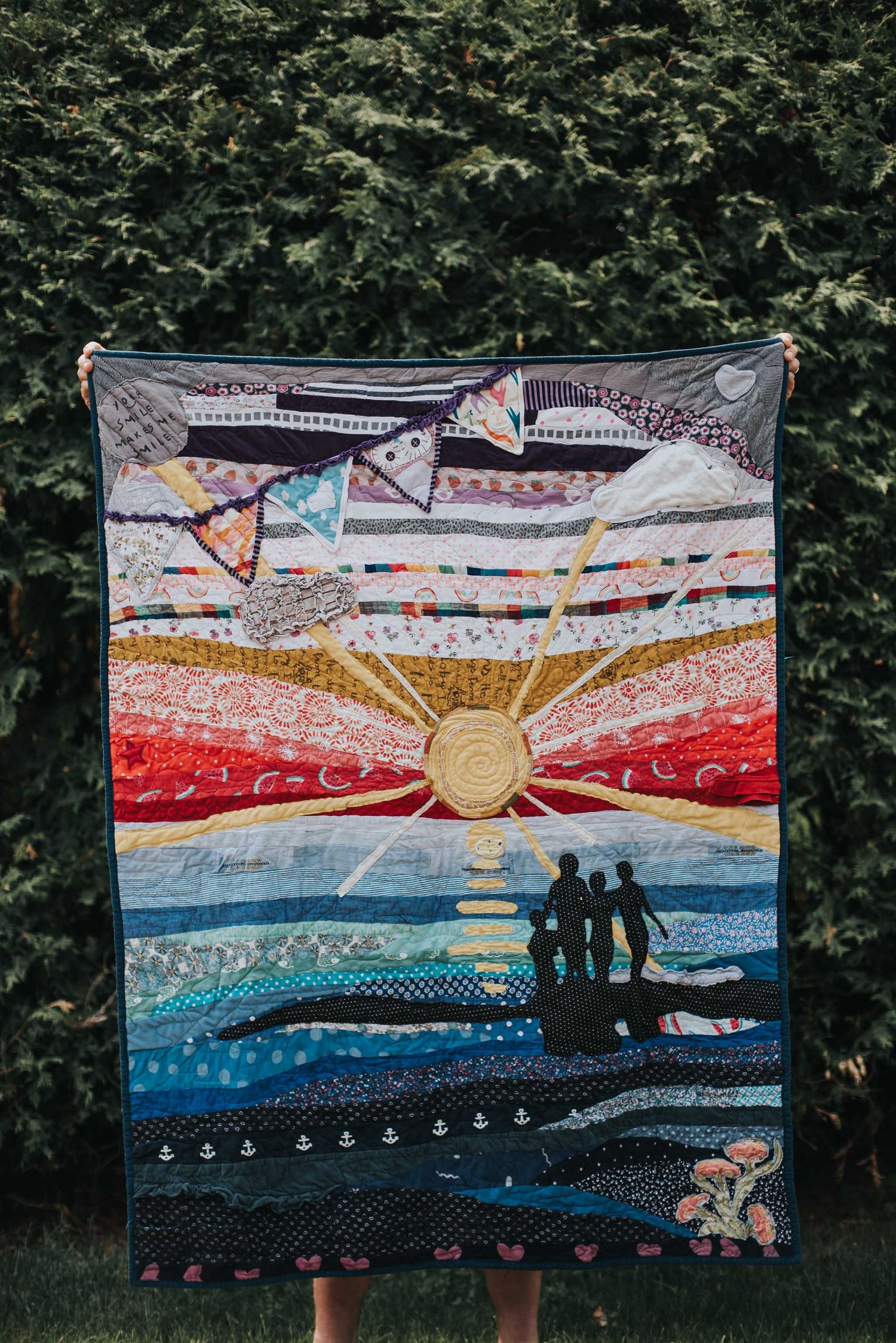 Art panel memory quilt by This Splendid Chaos showing a silhouette of siblings on the beach at sunset.