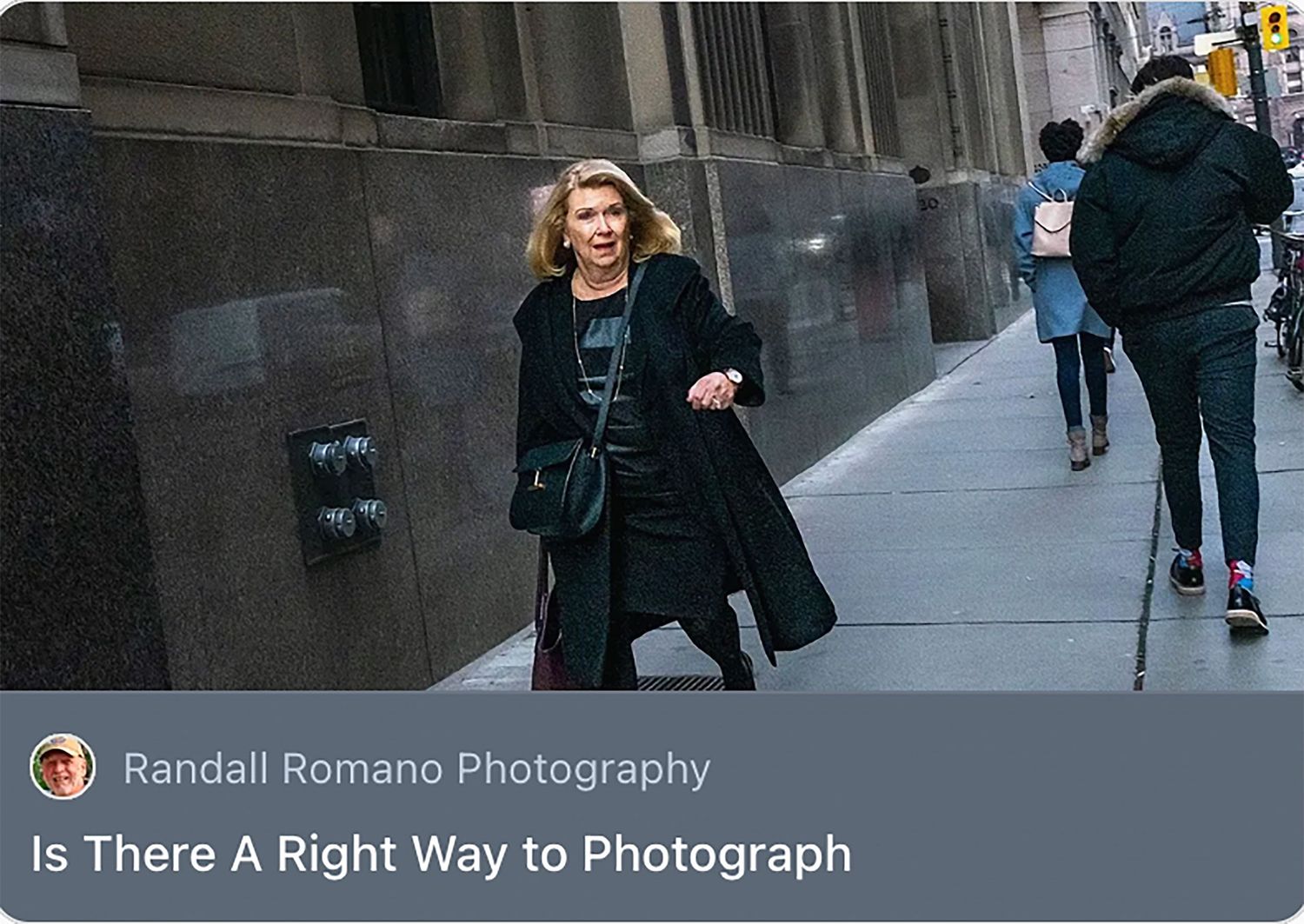 A stylish woman in a black coat walks confidently on a city sidewalk in an urban photography article.