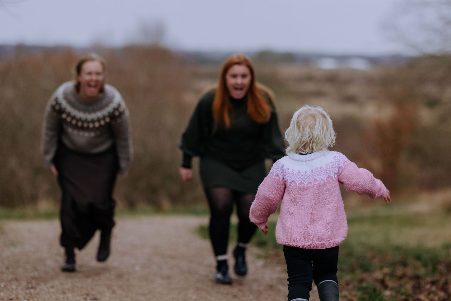 A sequence of candid outdoor photos showing people walking and playing together in a natural setting.