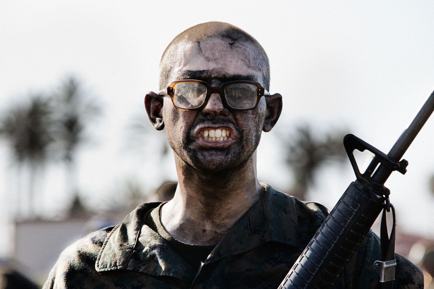 Armed military soldiers in tactical gear during a training exercise.