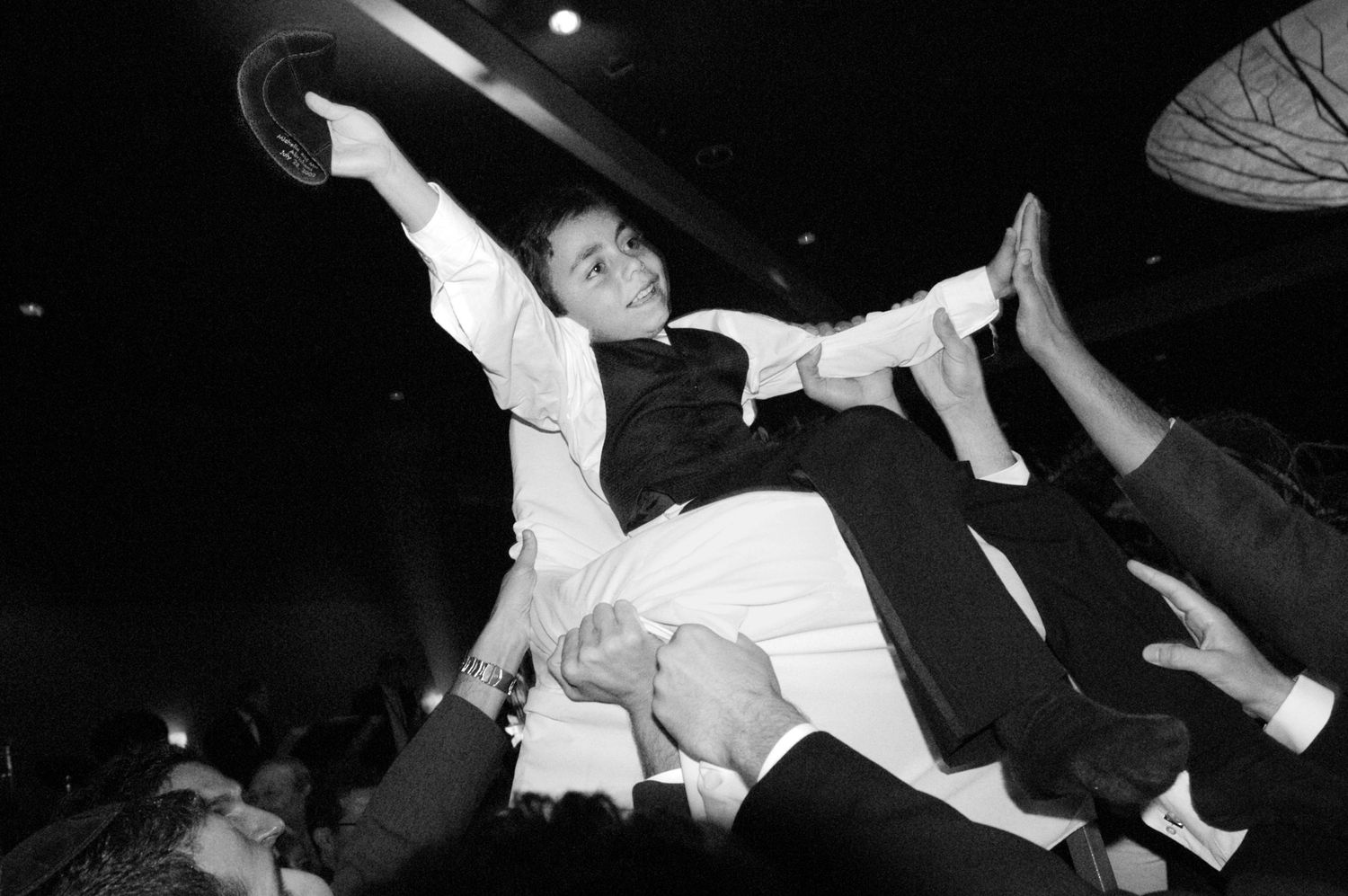 Dynamic performance shots capture dancers in mid-motion against black background.