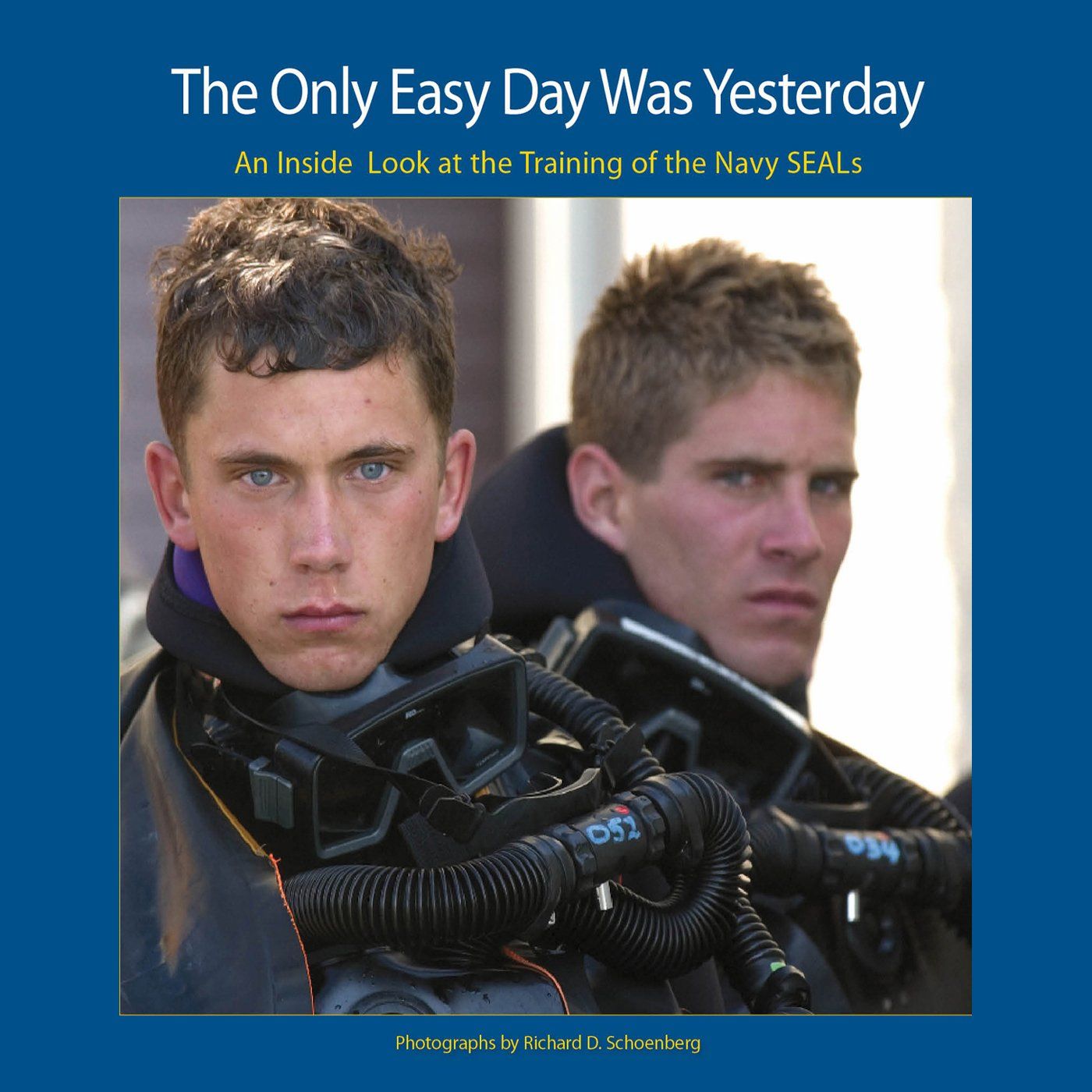 Book cover showing Navy SEAL trainees with diving equipment against blue background.