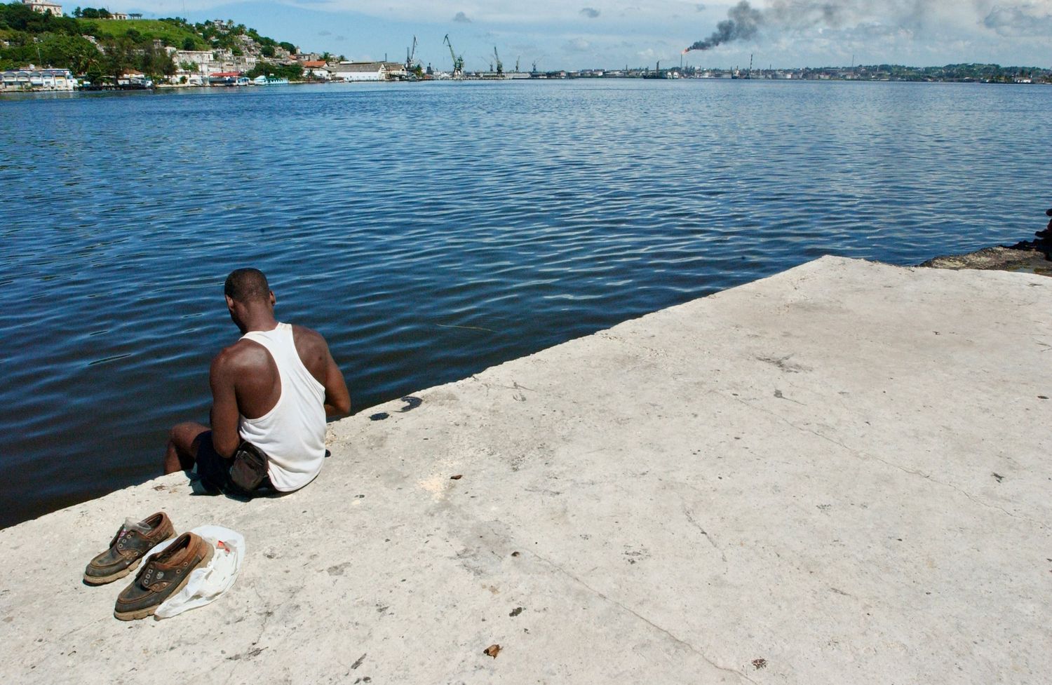 Man Overlooking Cuban Bay   - Photograph by Richard D. Schoenberg